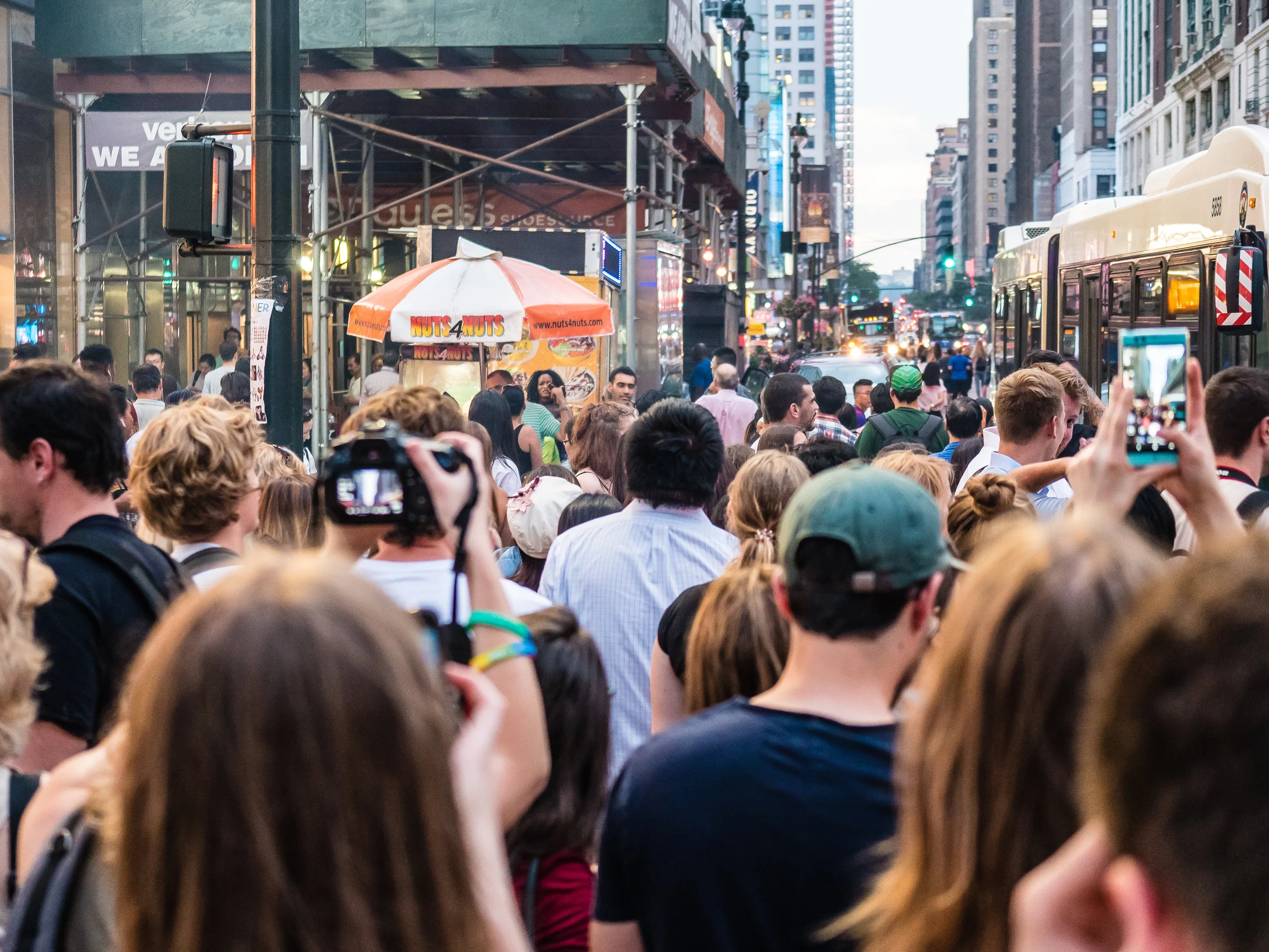 Crowd waiting for Manhattanhenge July 12, 2017 at West 34th Street and 6th Avenue in Manhattan ready to take pictures with cameras and smartphones.