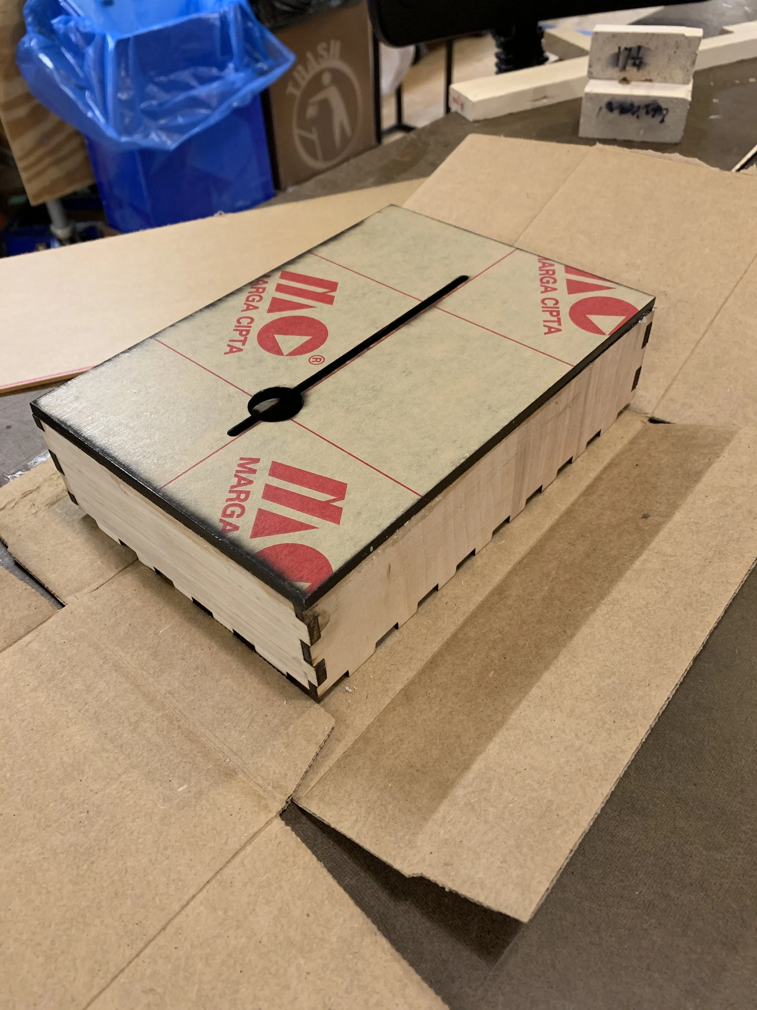  Assembly in progress, adhering acrylic on to wooden frame. 