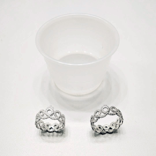 Compare: The ring on the left has been cleaned with ammonia, whereas the ring on the right has yet to go in.