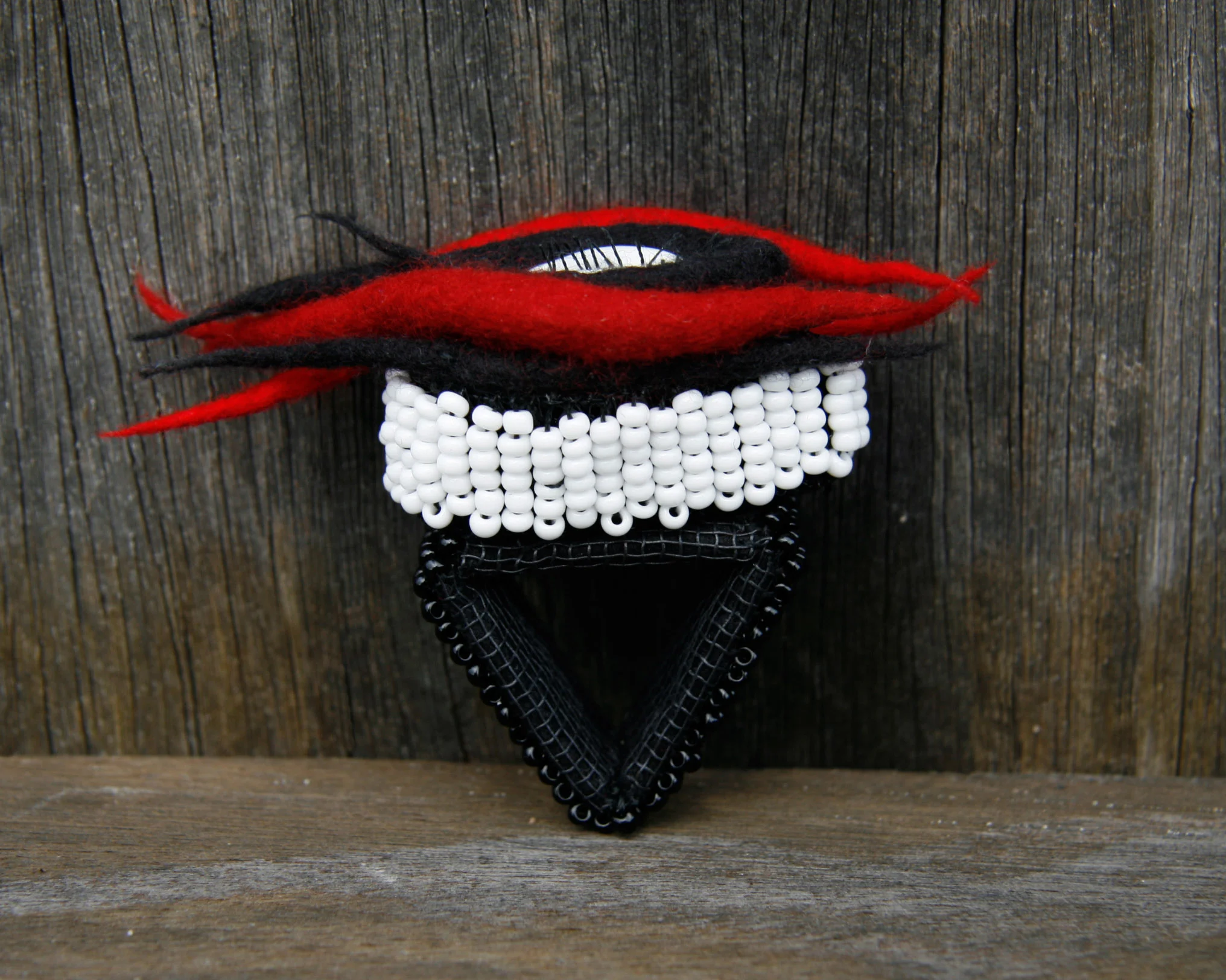 Humdinger ring (2008) Glass beads, felt, plastics, cowrie shell & hair