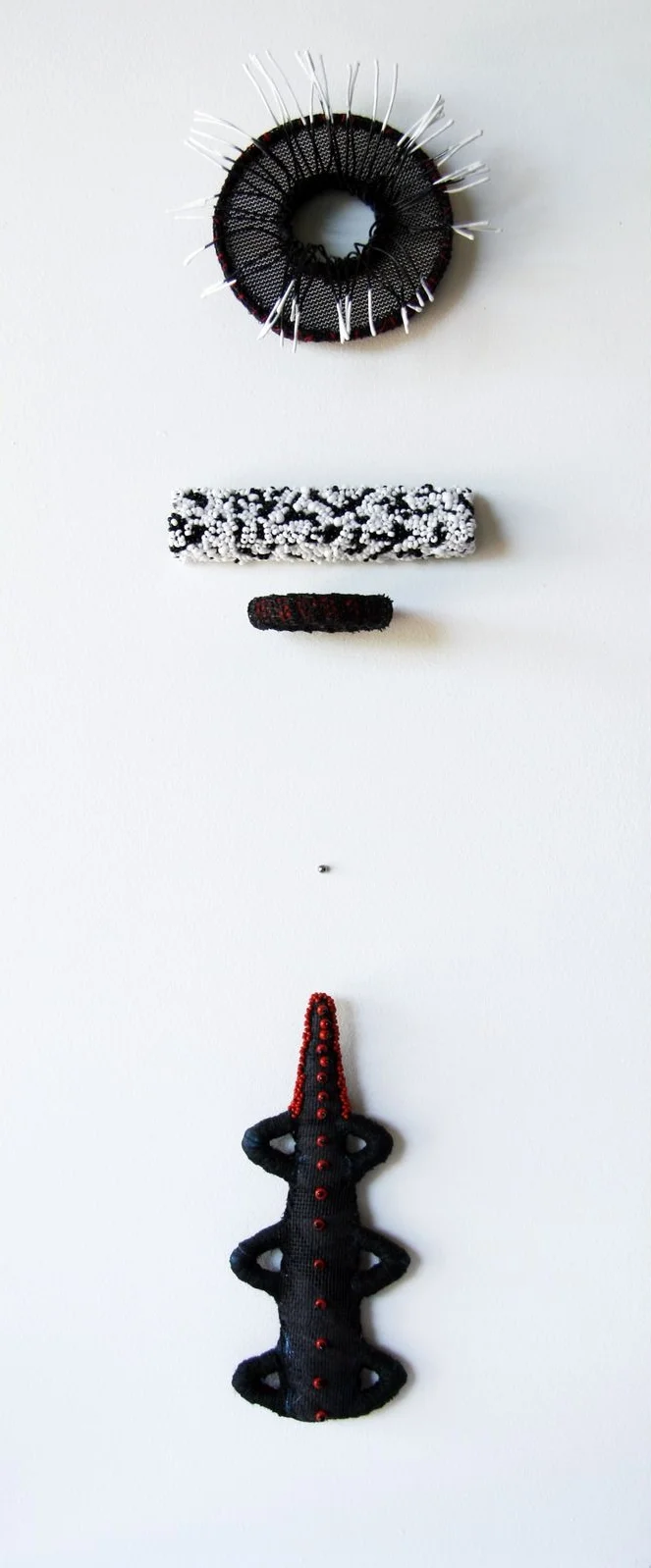 Counterpunk (2008). Wire, fibre, glass bead & ball bearing.