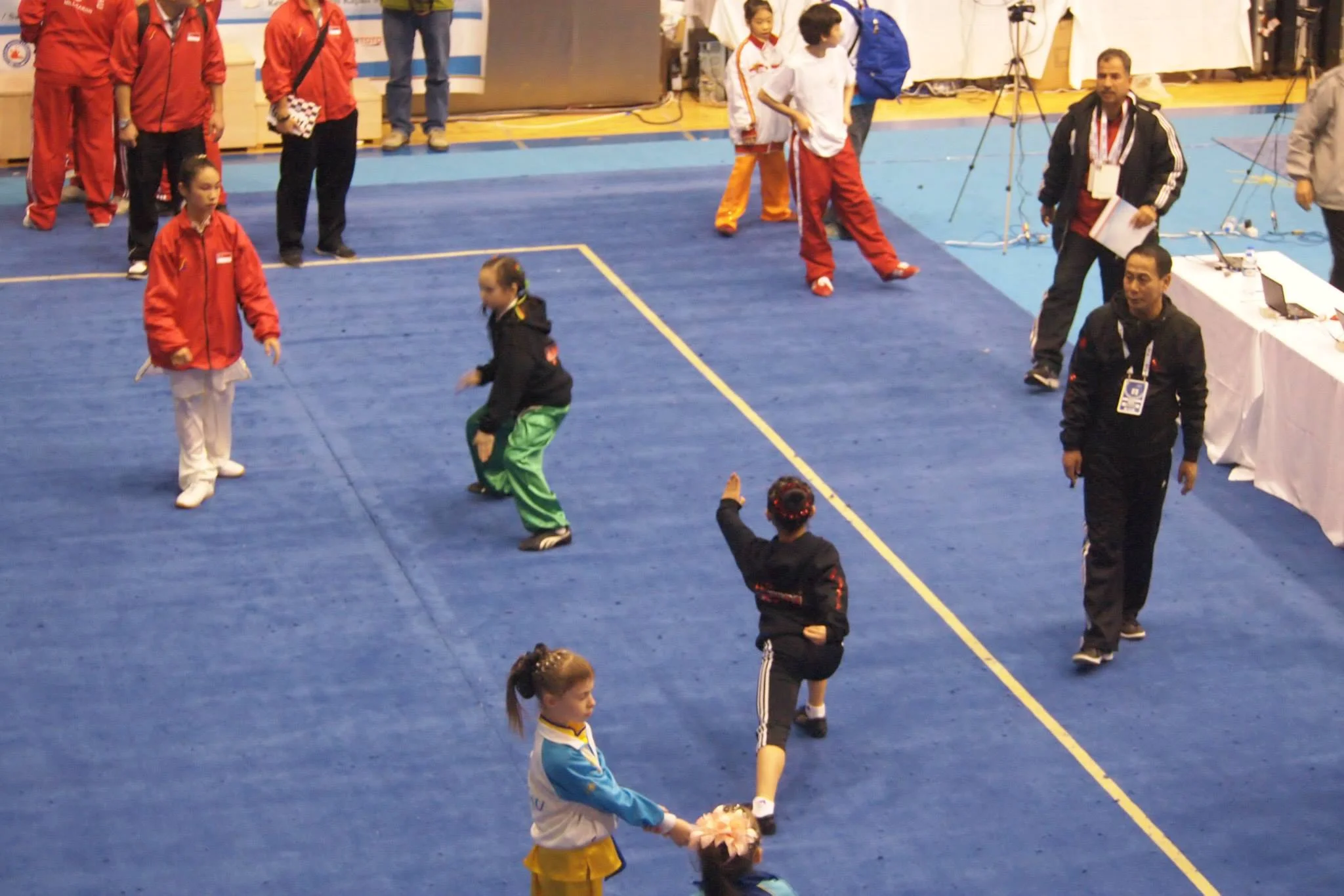 Erica and Julia warming up at the 5th World Junior Wushu Championships, 2014.