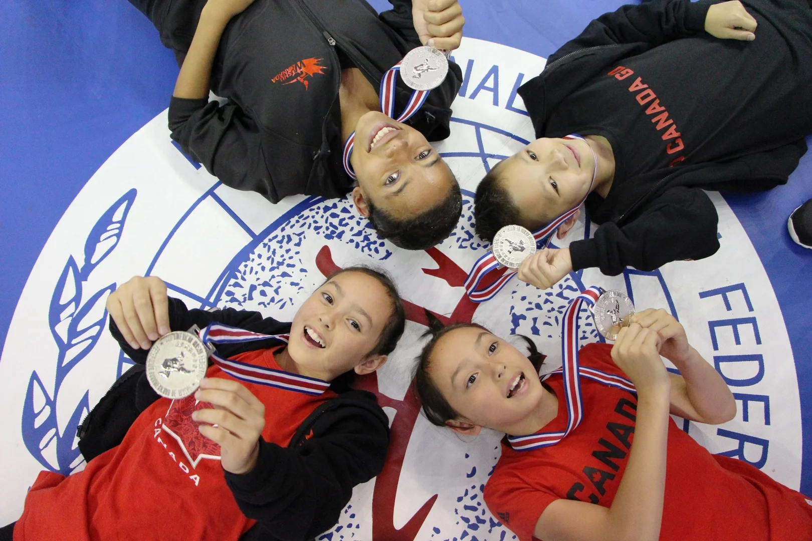 Teams Canada and Hong Kong at the 6th World Junior Wushu Championships, 2016.