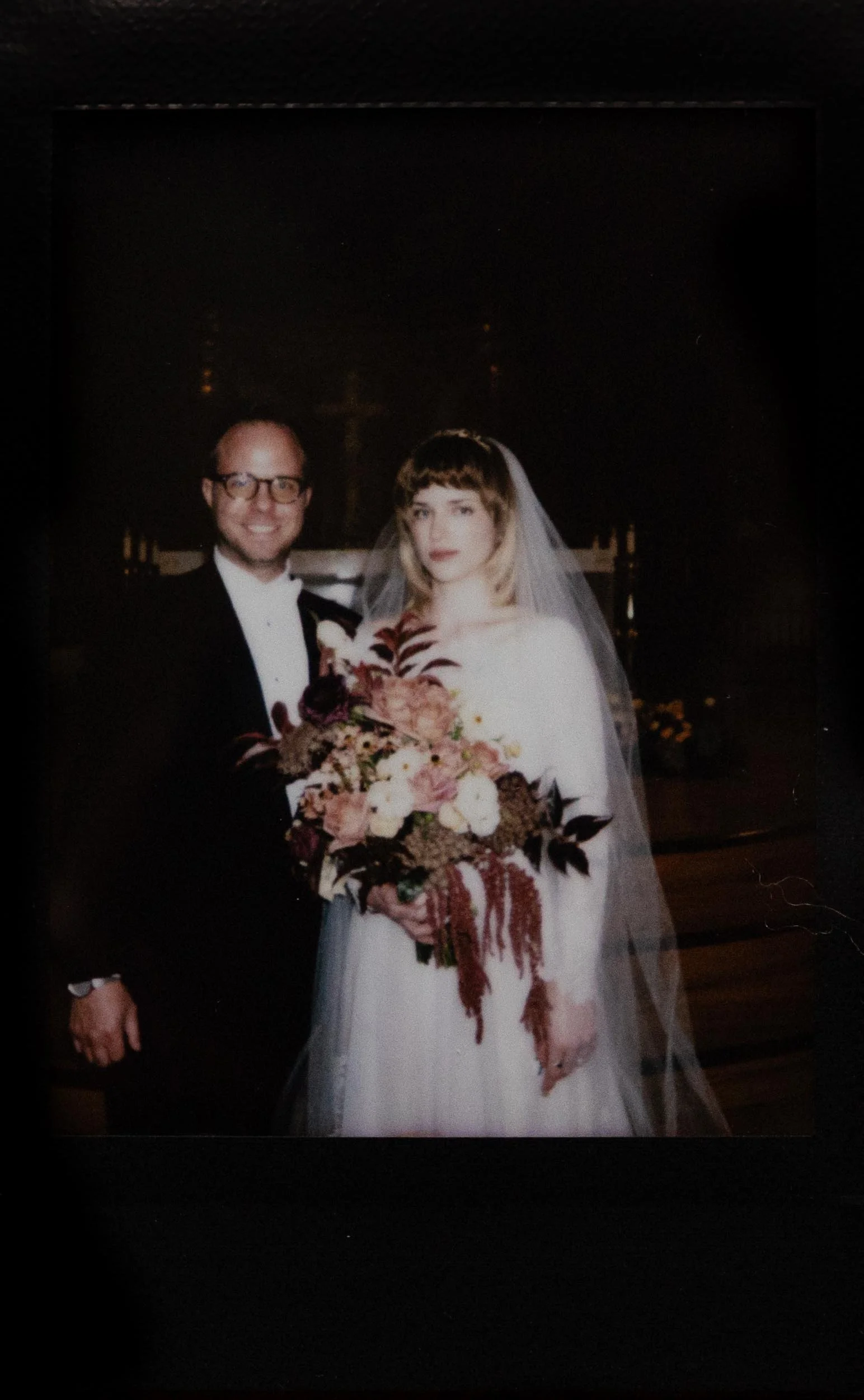 Instant film polaroid wedding photography a bride and groom pose inside the chapel of the Cathedral of the Immaculate Conception in Memphis, Tennessee. Moody Memphis wedding photographer. Memphis film wedding photographer.