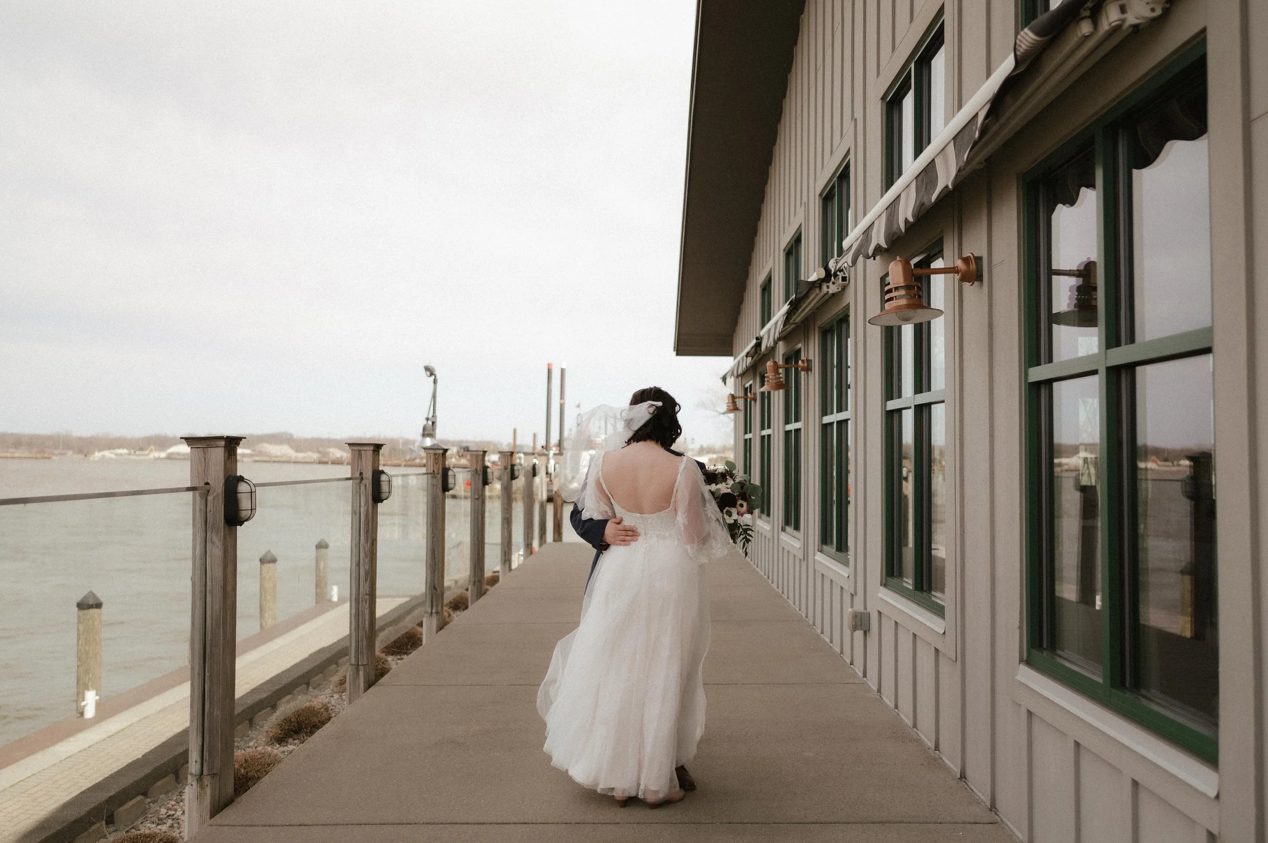 Wedding photos inspired by Wes Anderson, wedding photos inspired by The Grand Budapest Hotel. Holland Michigan wedding at Boatwerks, moody Michigan photographer, cinematic Michigan wedding photographer, Michigan documentary wedding photographer