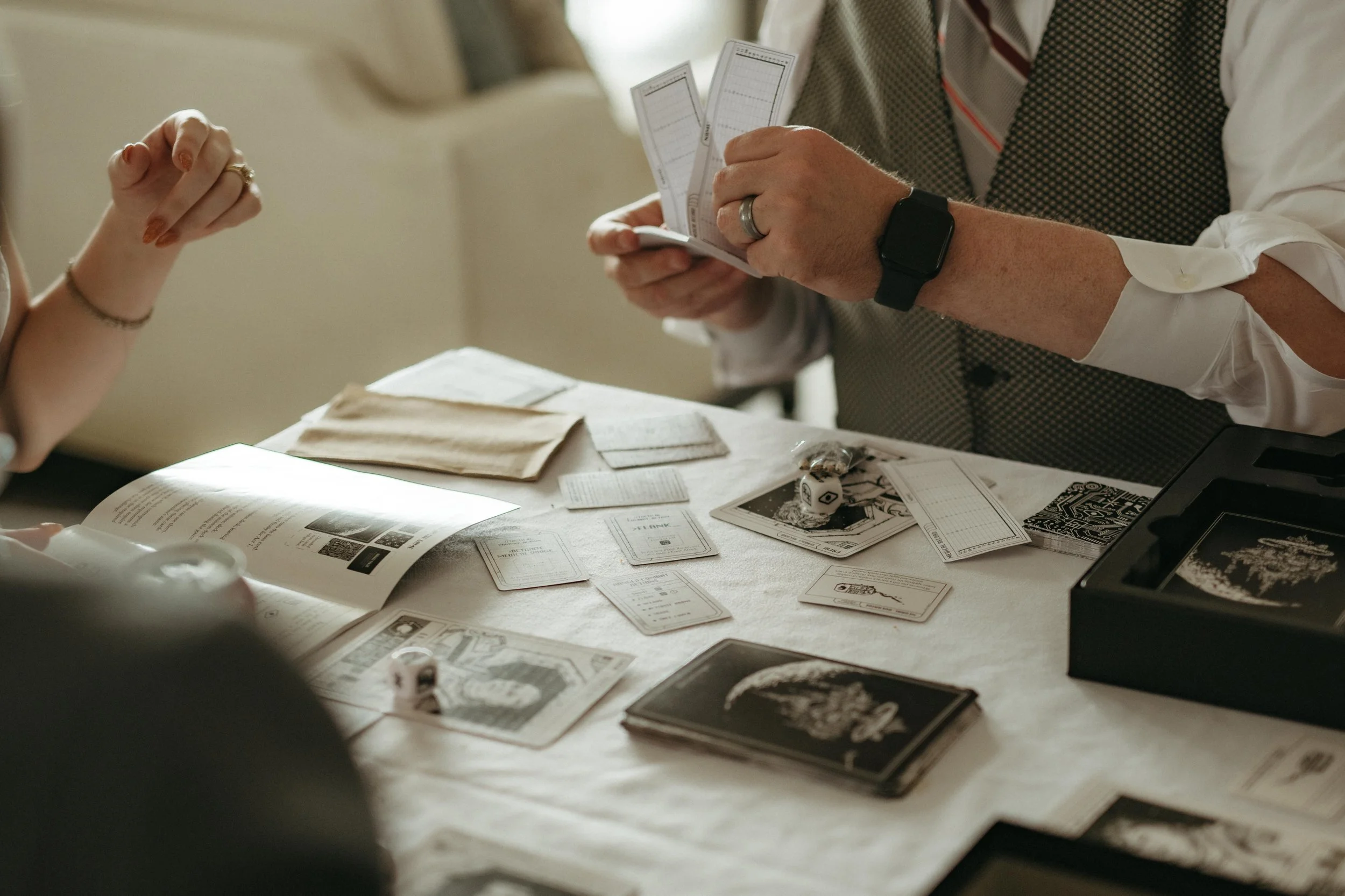 Moody Memphis wedding photographer a bride and groom play a board game at their wedding reception. Documentary Memphis Wedding Photographer. Cinematic Memphis wedding photographer.
