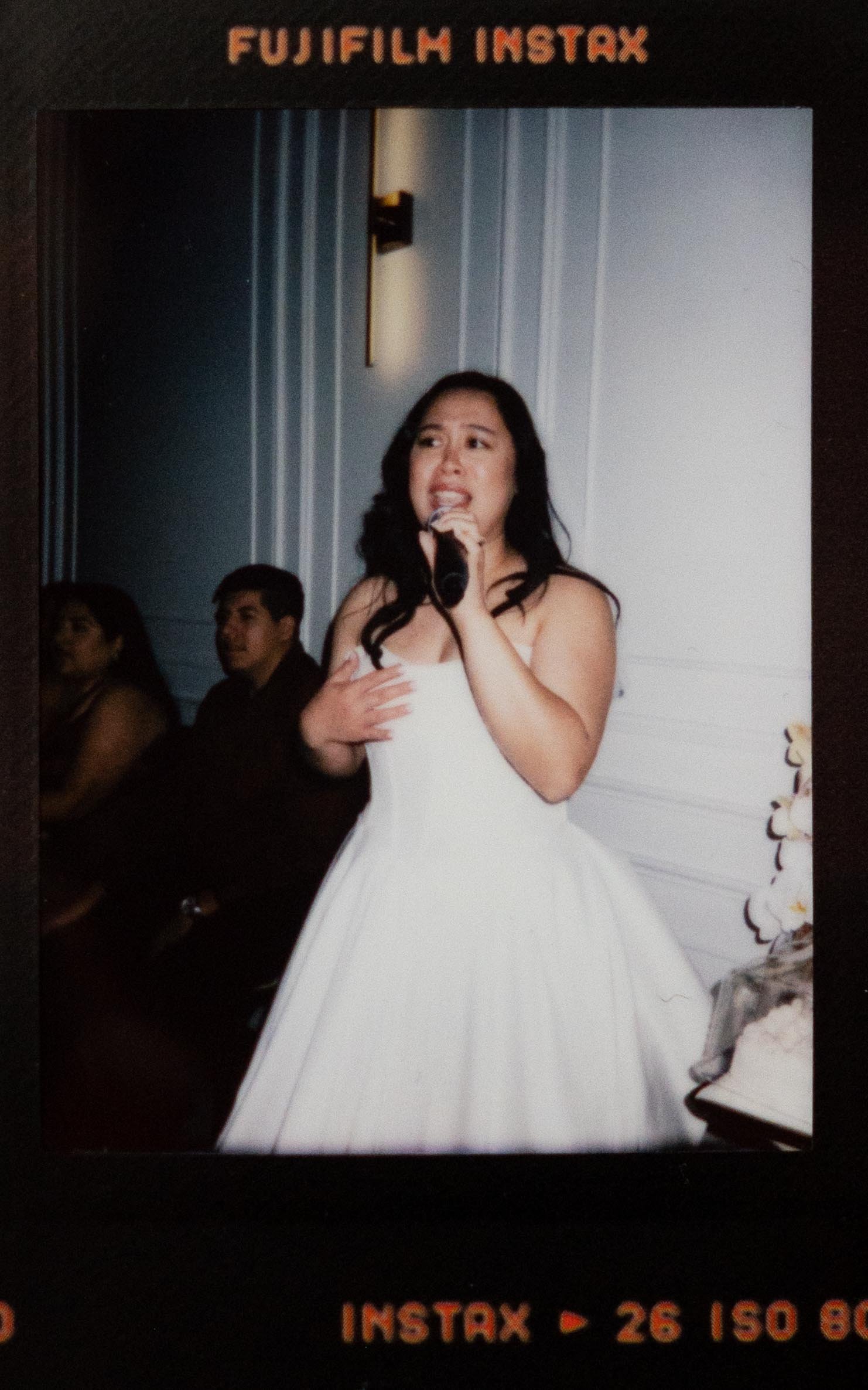 Instant film polaroid wedding photography bride singing karaoke in the Parisian in Huntsville, Alabama. Moody Huntsville wedding photographer. Documentary Huntsville wedding photographer. Huntsville film wedding photographer.