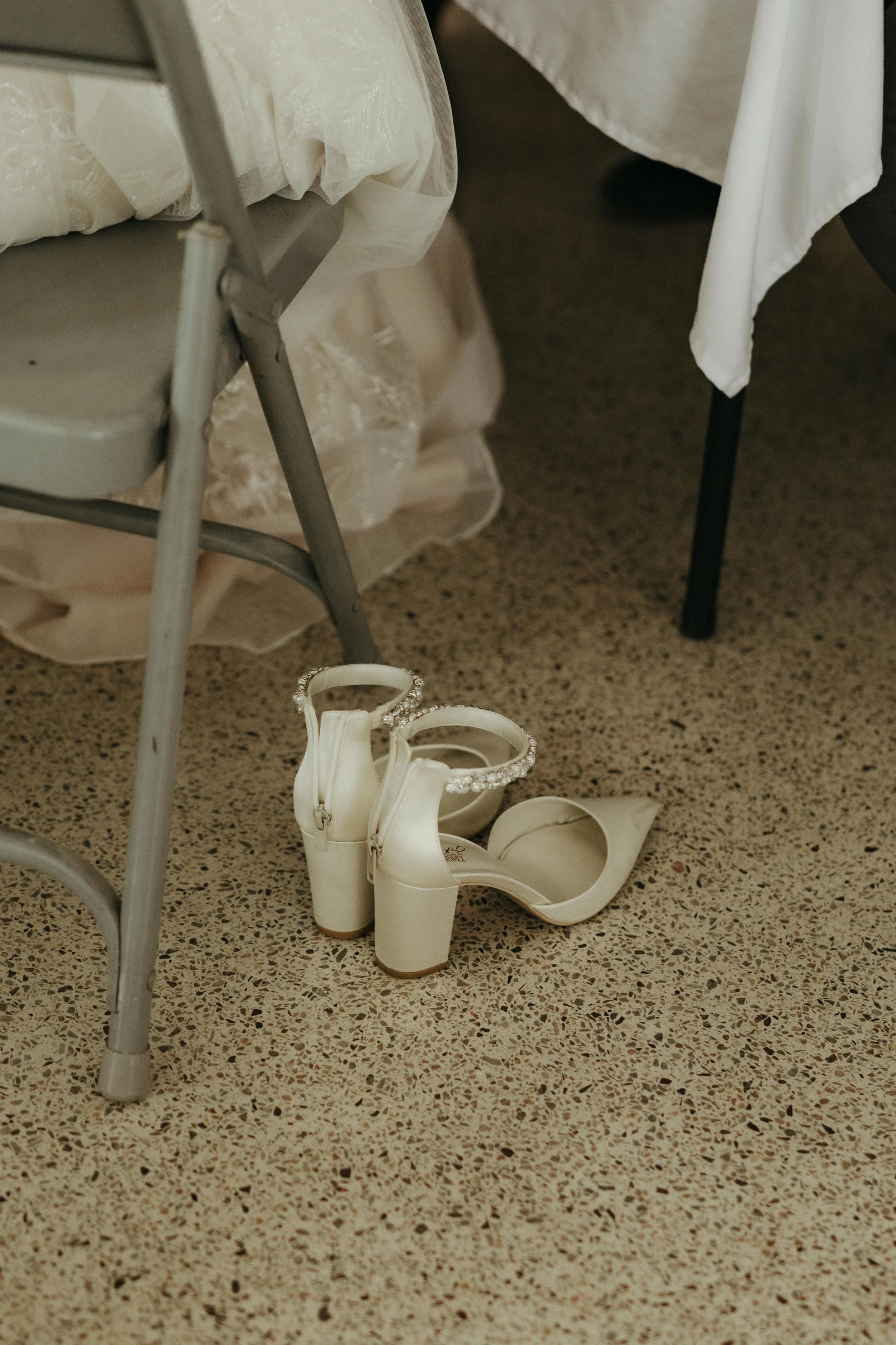 Moody Memphis wedding photographer a bride and groom play a board game at their wedding reception. Documentary Memphis Wedding Photographer. Cinematic Memphis wedding photographer.