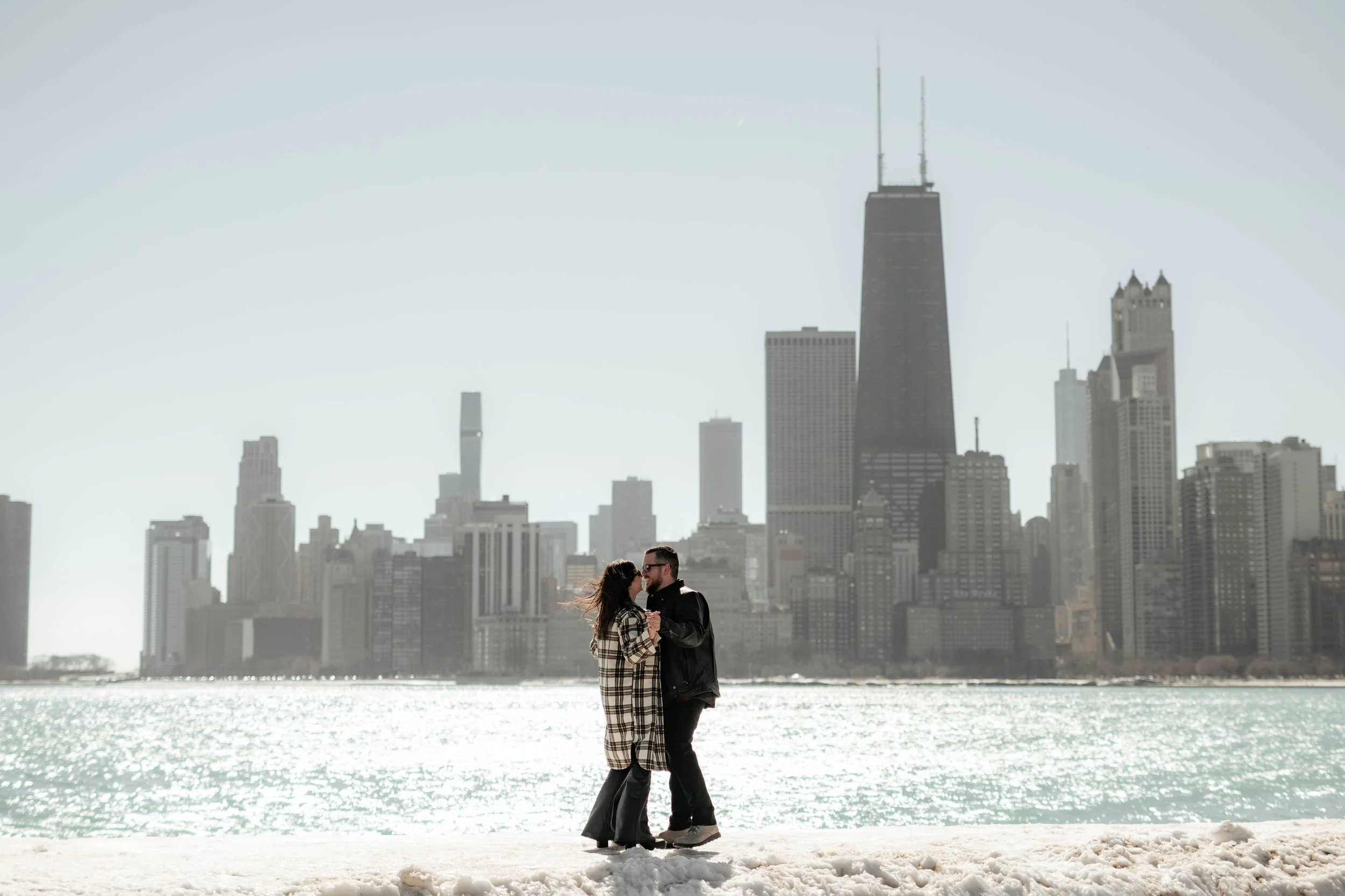 Couple posing in front of the Chicago skyline. Moody Memphis wedding photographer. Moody Chicago wedding photographer. Moody Illinois wedding photographer.