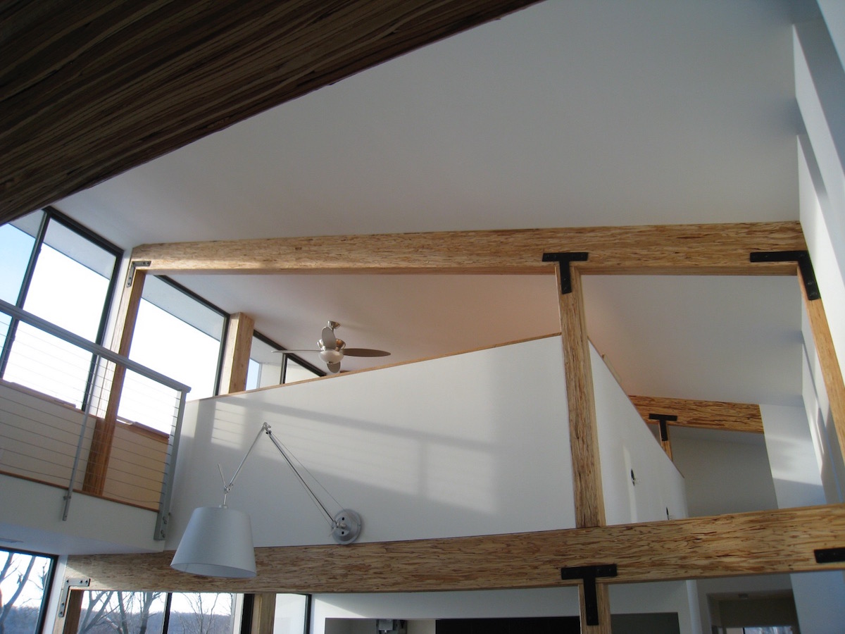 wood beams and floor to ceiling windows