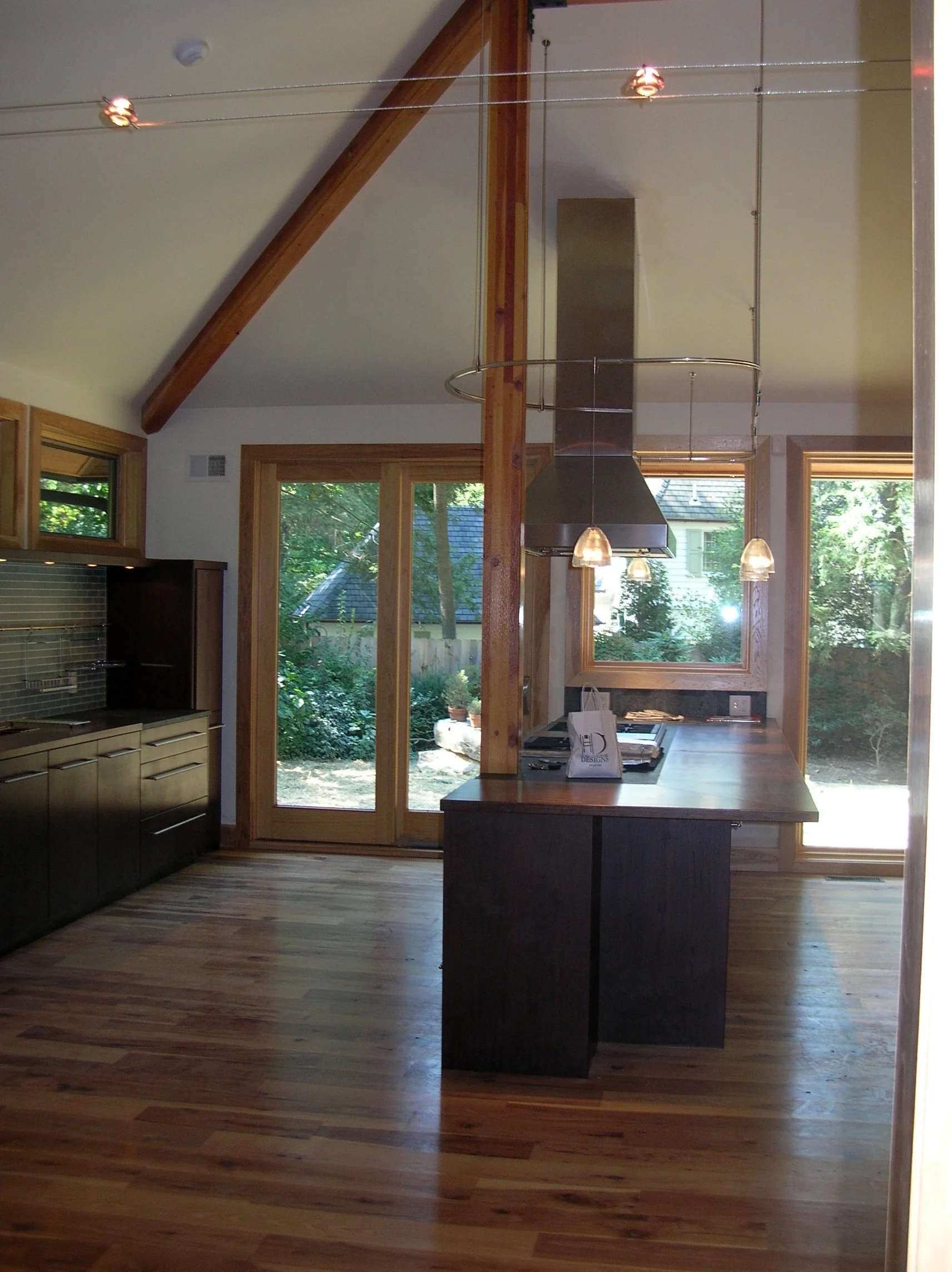 Price Kitchen Island Wood Flooring Island Rangehood Glass Backsplash Dark Wood Cabinets.jpg