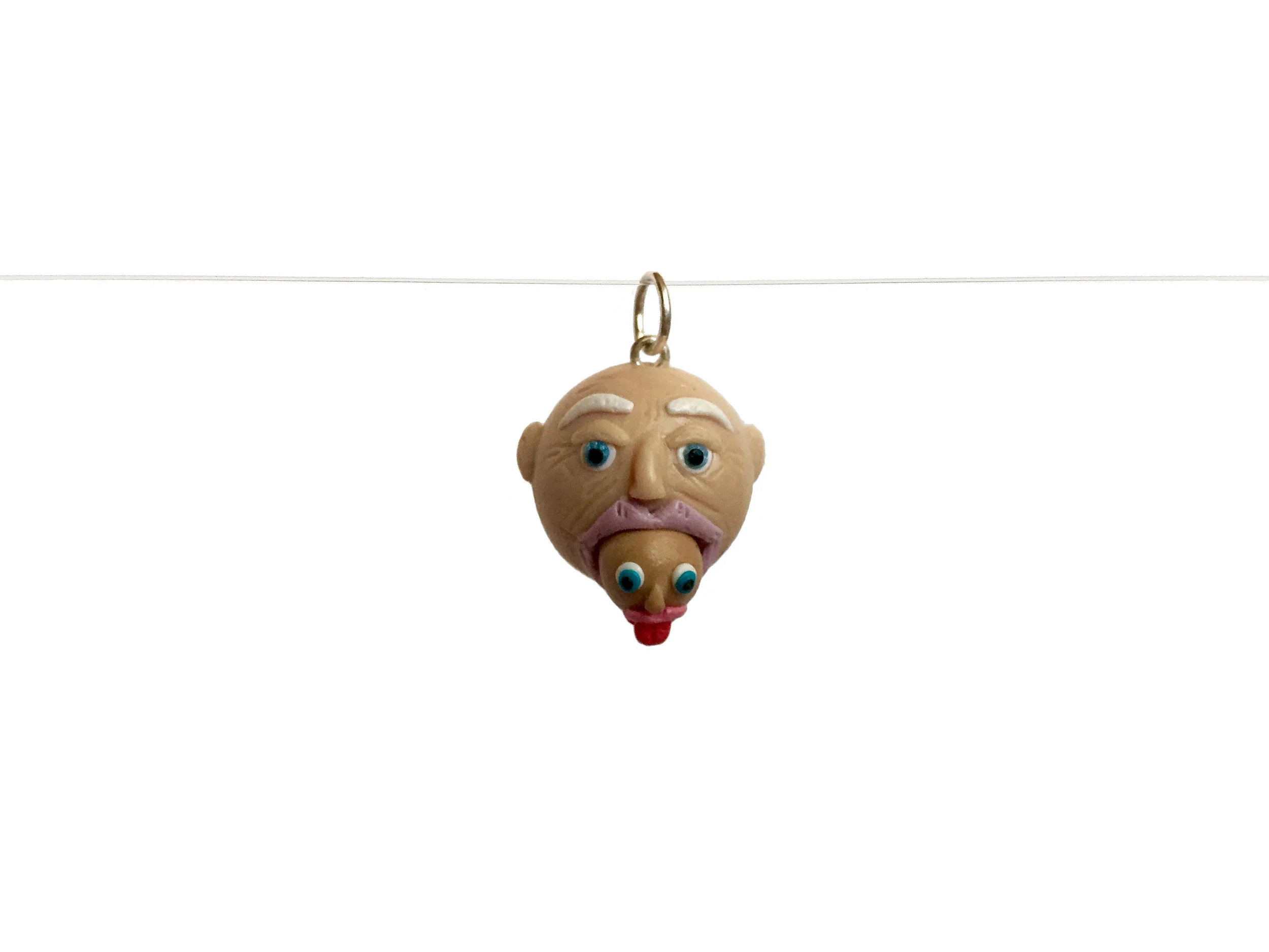 Old Man Spitting Out Baby Head Polymer Clay Charm