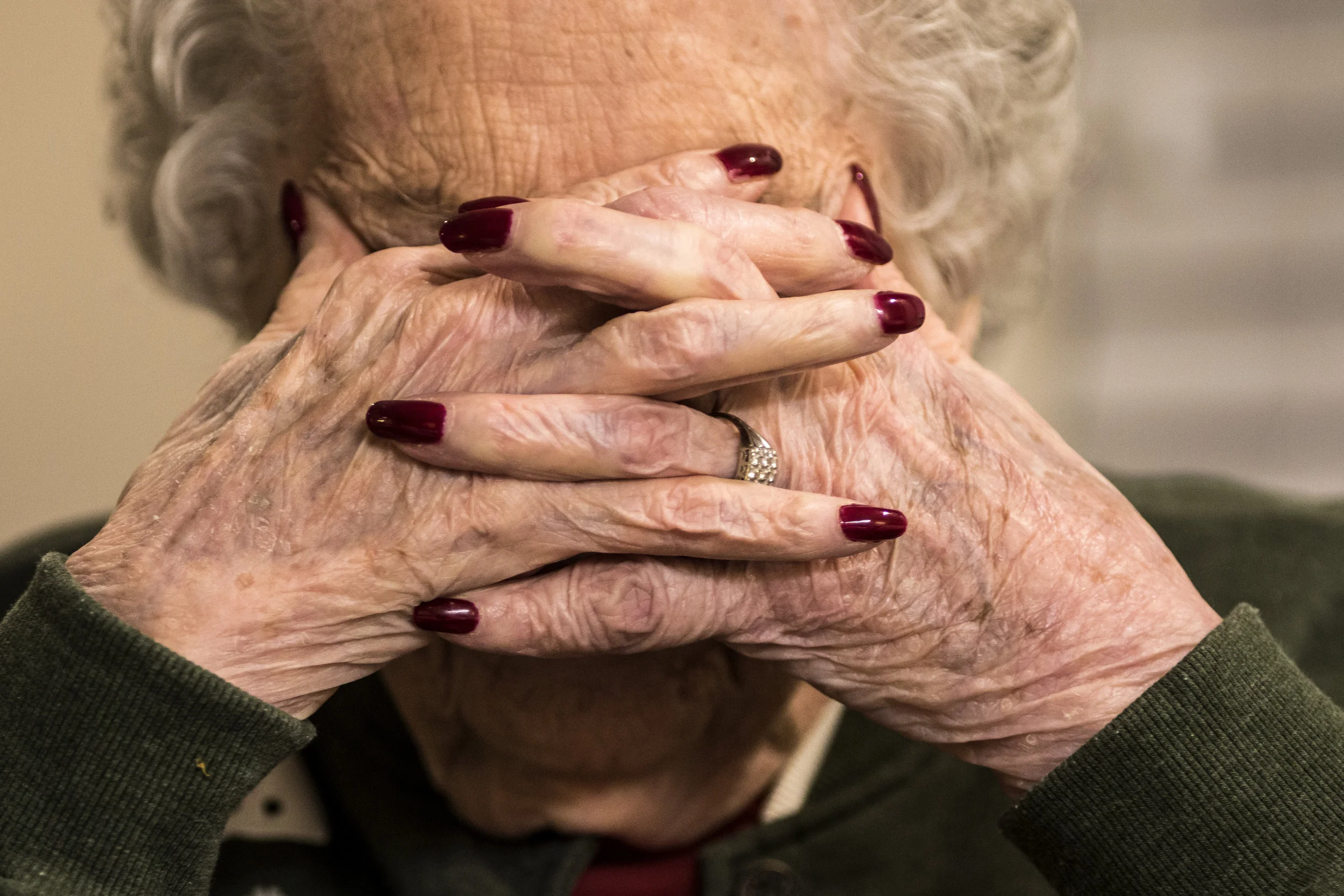  Dorthy Dixon, 94,&nbsp;rests her face in her hands while her daughter tells an embarrassing story about her from 40 years ago, Thursday, Dec.&nbsp;22 at a nursery home, in Muncie, Ind. A few days later, Dixon passed away due to natural causes.&nbsp;