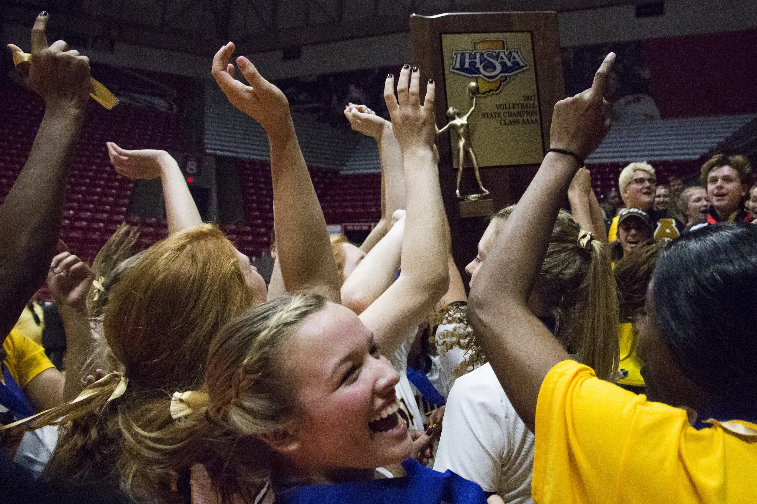  Avon volleyball players celebrate after being given the IHSAA State Championship trophy. The Orioles swept Crown Point in three straight sets, (25-17, 25-18, 25-18) during the 4A State Championship game at Worthen Arena on the Ball State University 