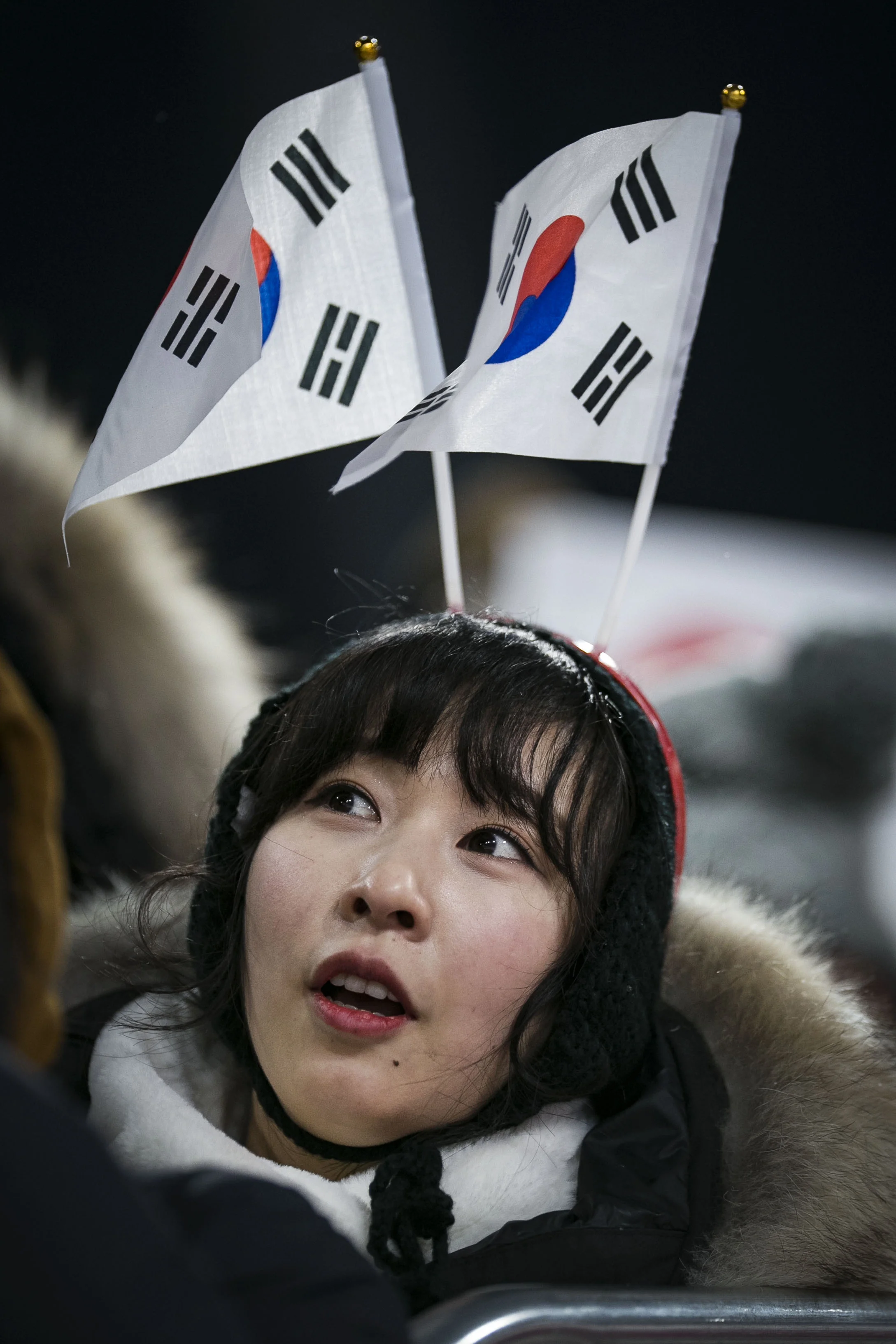  A South Korea fan watches ski jumping from the sidelines, Feb. 16, at PyeongChang Ski Jumping Center, South Korea during the 2018 Winter Games.  