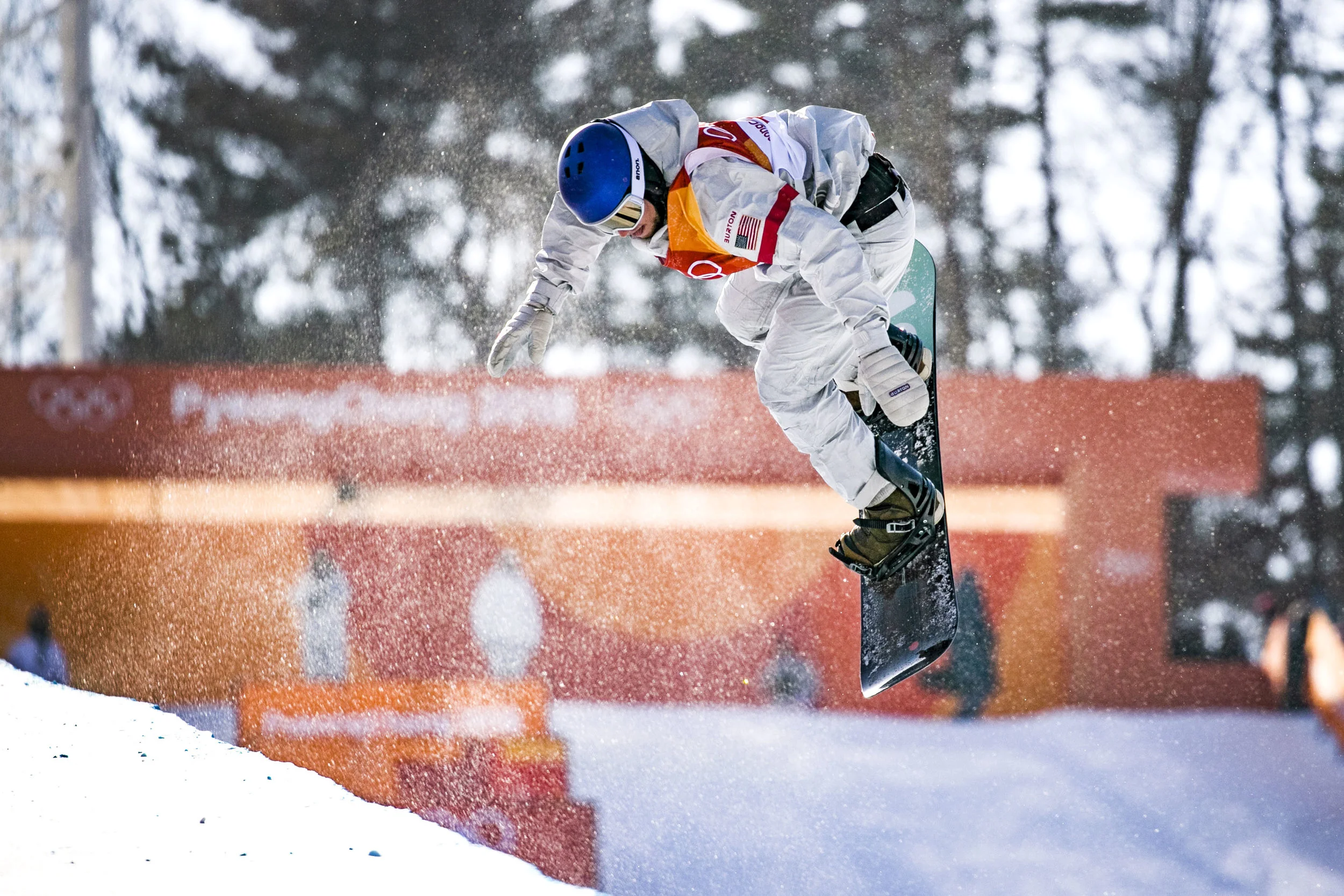  USA’s Ben Ferguson preforms a trick in the second heat of the of men’s halfpipe qualification, Feb. 13, at Phoenix Snow Park. Ferguson’s highest score from both runs was a 91.00, leaving him fourth going into final round.  