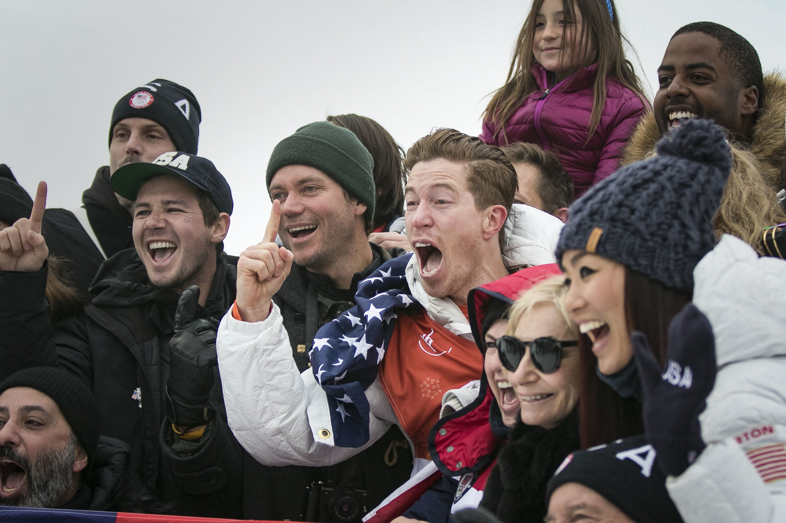  Halfpipe champion snowboarder Shaun White, smiles and cheers with his family and friends in the middle of the halfpipe after winning his third Olympic gold medal in the Men’s snowboarding halfpipe finals, Feb. 14, at Phoenix Snow Park.  