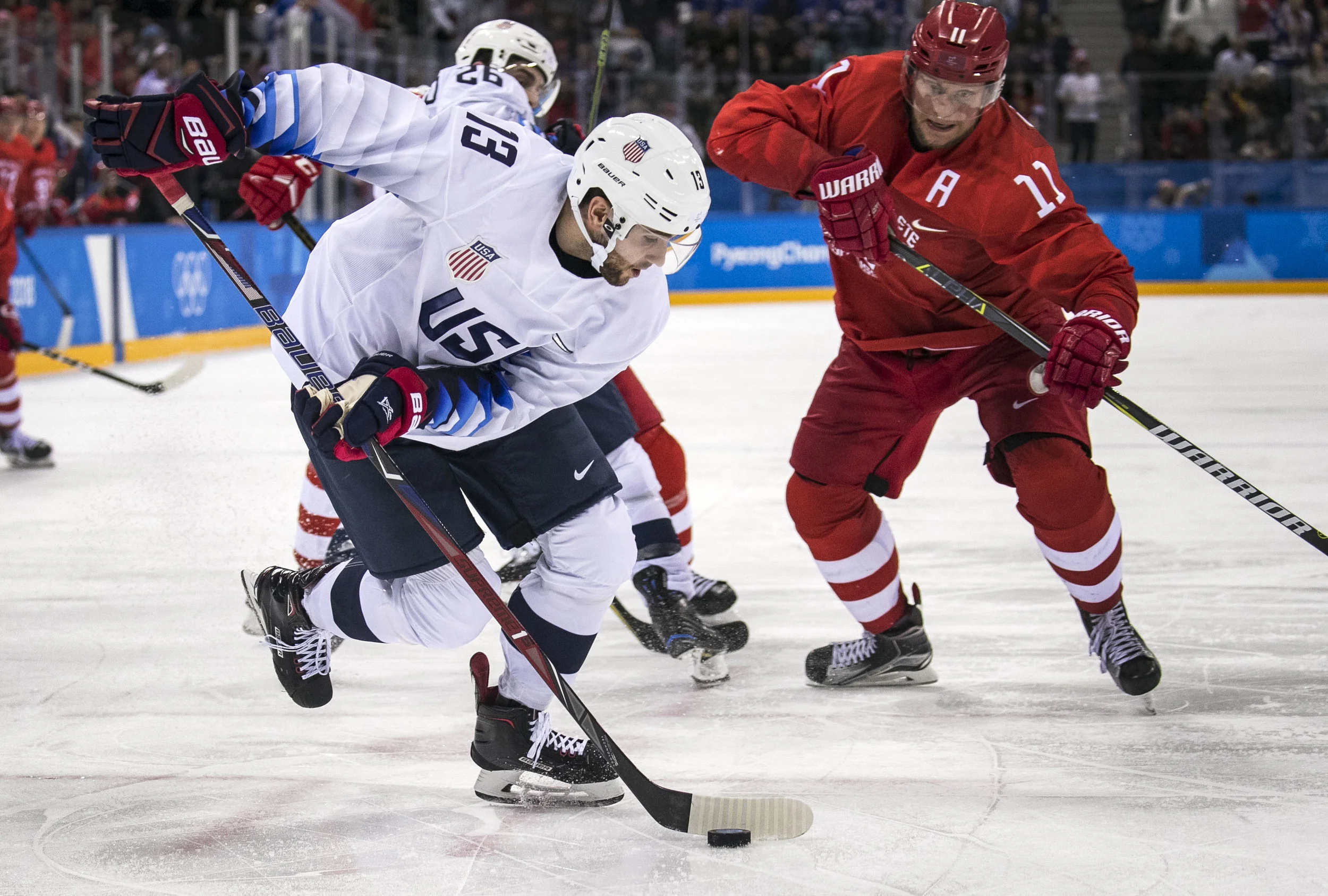  U.S. men’s hockey team, forward Ryan Gunderson, retrieves the puck to score against the Olympic Athlete’s of Russia, Feb. 17, at Gangneung Hockey Centre. U.S. lost, 4-0 in a shut out against the Olympic Athlete’s of Russia. Grace Hollars, BSU at the