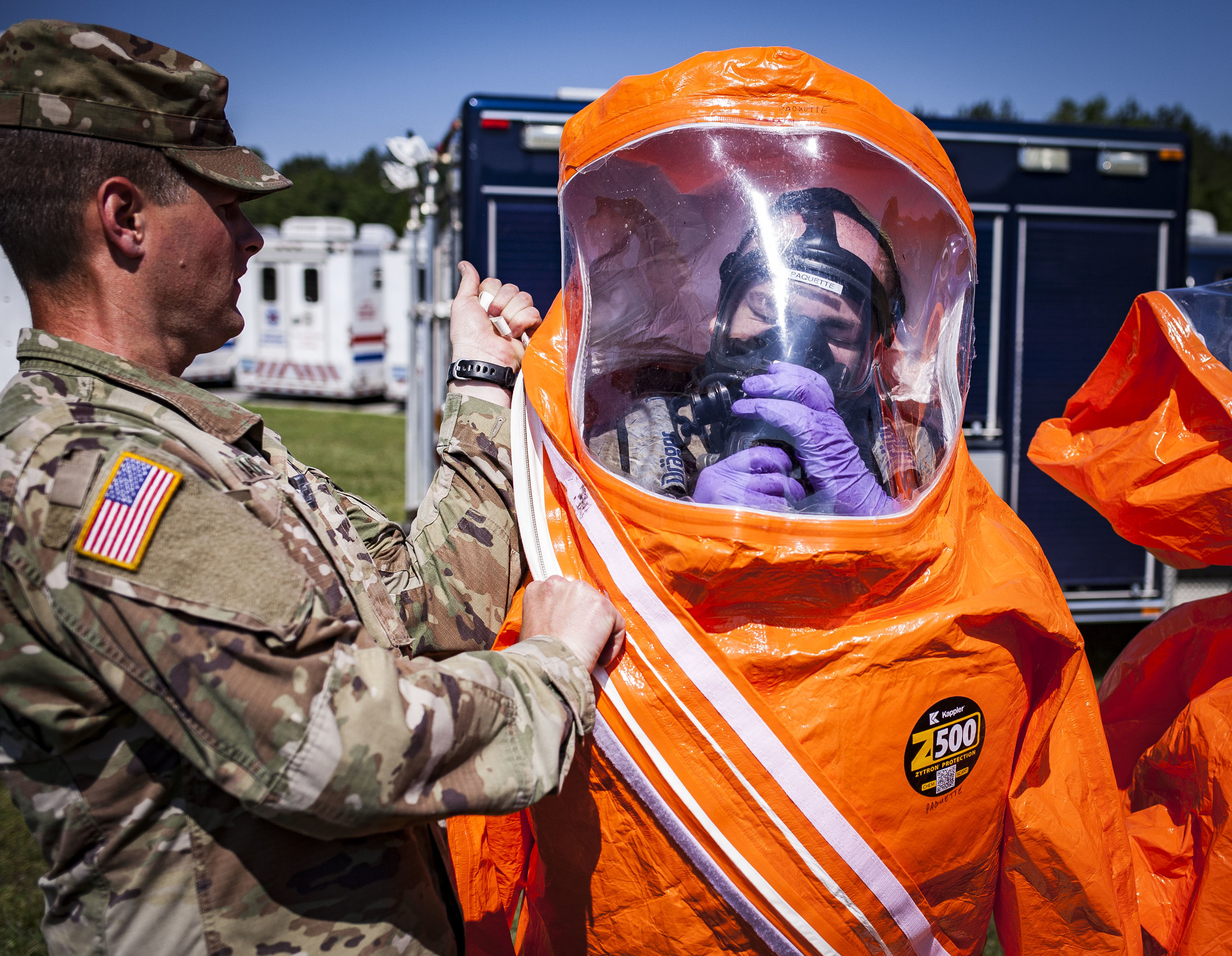  Stg. 1st Class David Paquette of the Virginia National Guard's Fort Pickett-based 34th Civil Support Team, straps on his boots and hazmat suit for the second day of the two day Training Proficiency Evaluation, Thursday, May 24, Richmond, VA. The tra