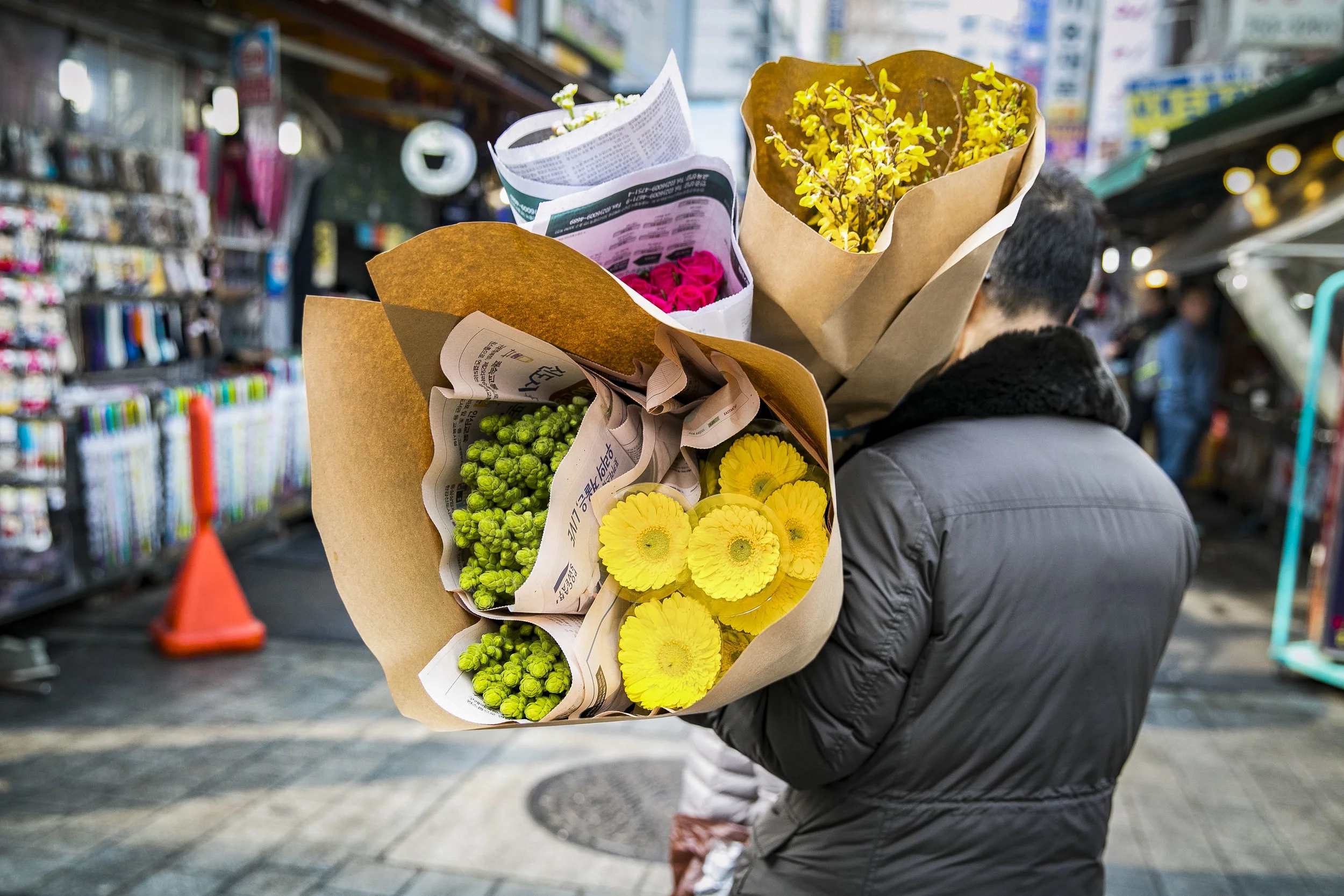  The Namdaemun market is the largest and oldest in the city of Seoul, South Korea located behind the “Great South Gate.” The market has traditional food, clothing, a fish market, and accessories. Between the cars driving through the crowded streets a