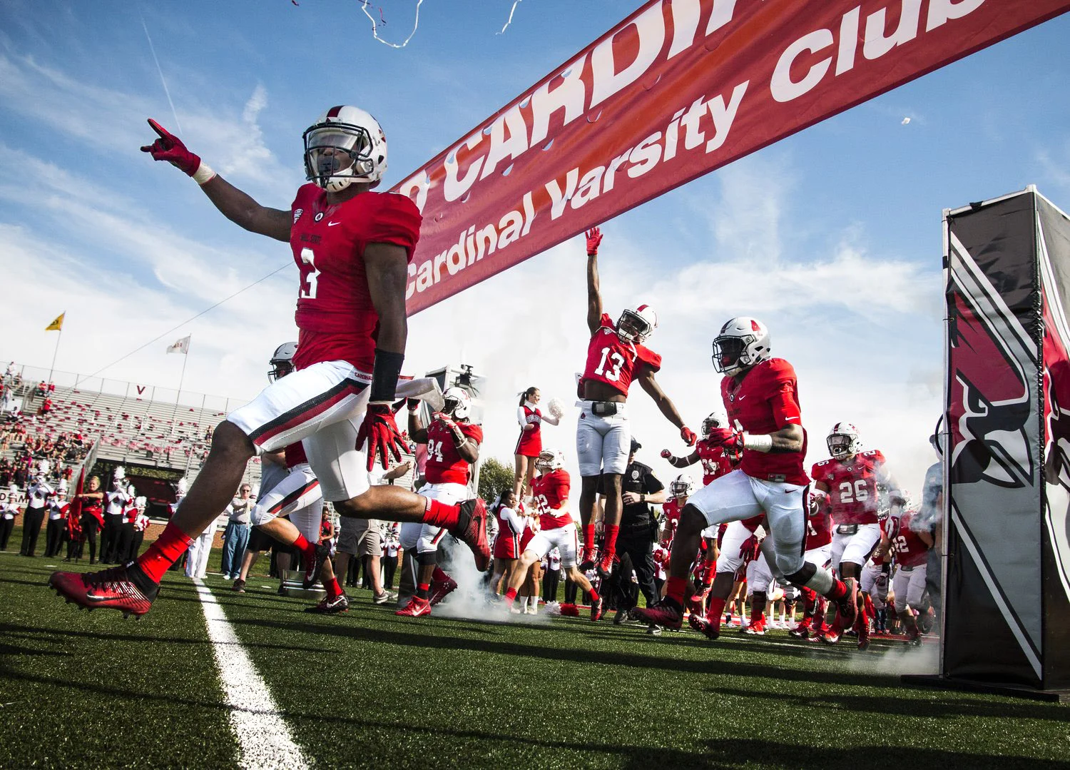 Ball State players rush on to the field through smoke and confetti for the homecoming game against Central Michigan, Oct. 21 at Scheumann Stadium. Ball State lost to Central Michigan, 9-56.  Photos for Ball State Daily News  