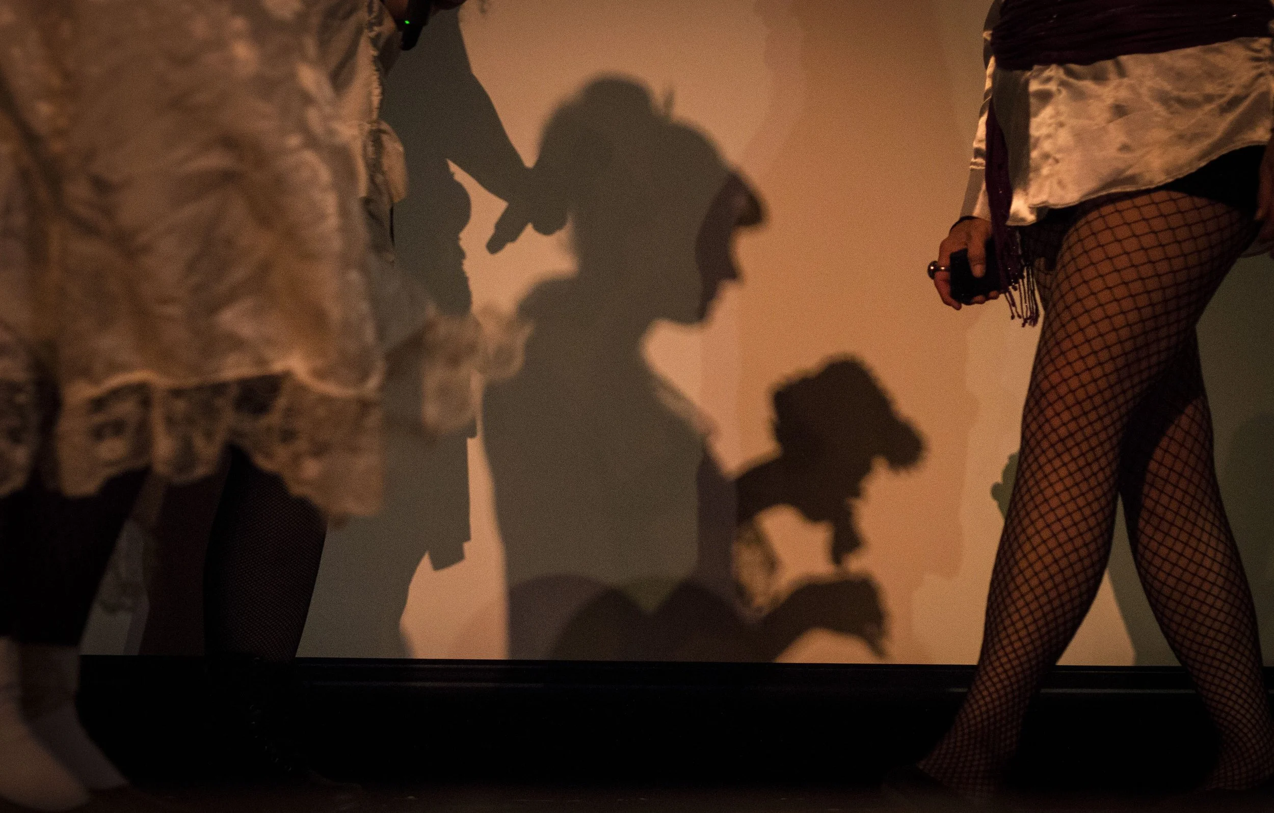  A shadow is casted on a screen as cast members and audience walk the stage at Cornerstone Center for the Arts before the start of The Rocky Horror Picture Show, Saturday, Sept. 29, in Downtown Muncie. This is Cornerstone's fifth showing of Rocky Hor