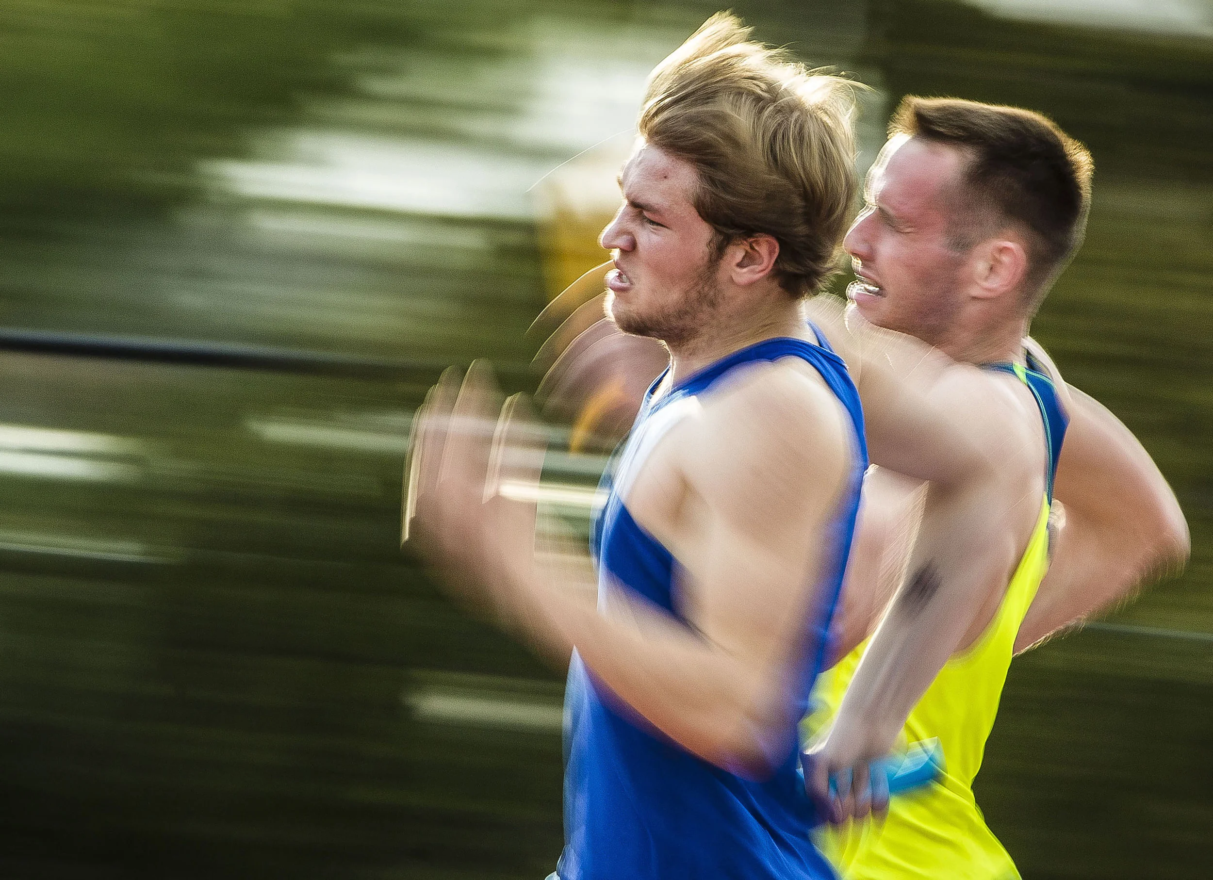  Men's track 4 by 400 meter relay sprints around the final turn in the second to last leg of the race, April 13, at Ball State University Track in Muncie, Ind.  Photos for Ball State Photo Services, Marketing and Communications  