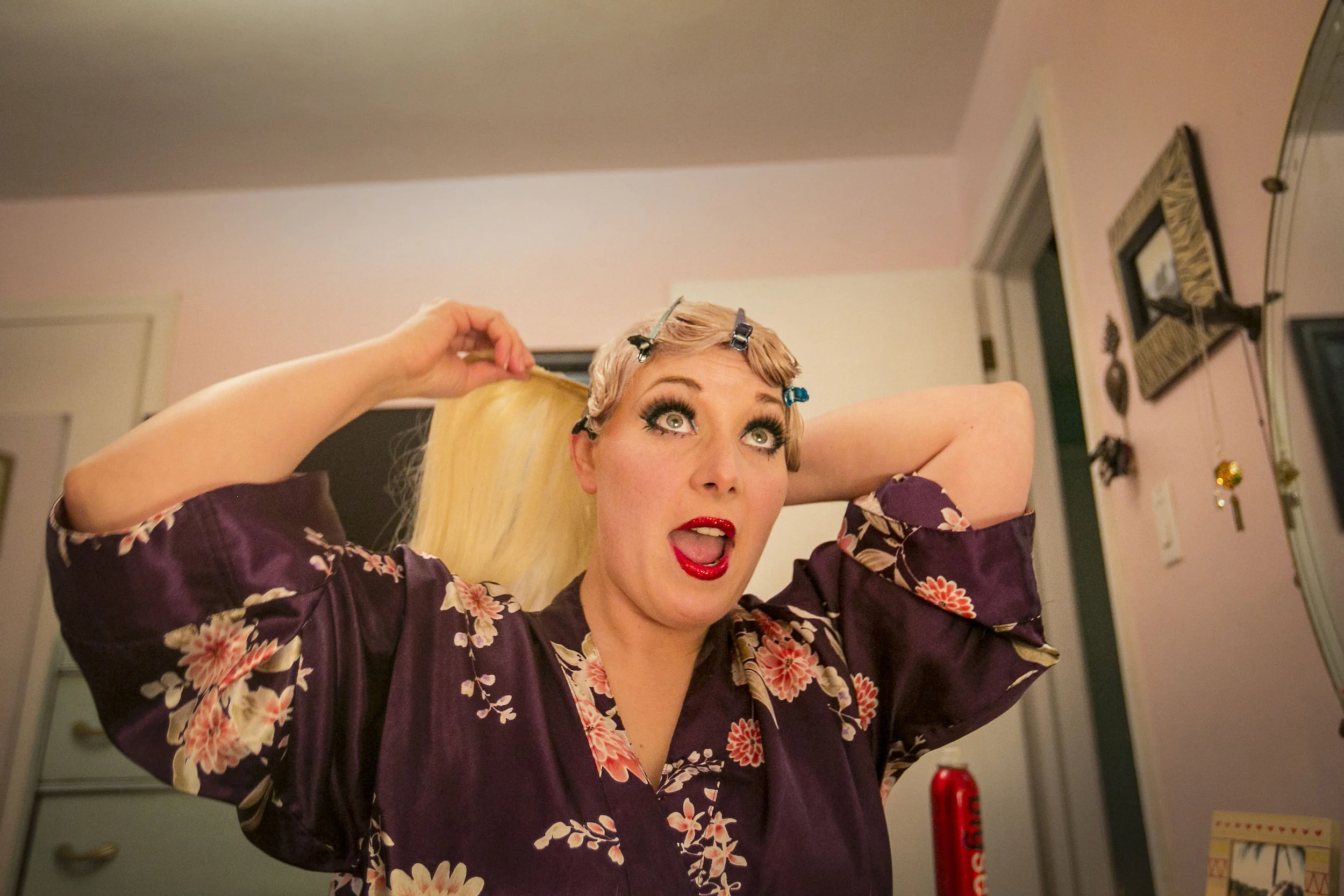  Stephanie Hutchison yells for her boyfriend while putting in hair extensions, Feb. 27, at her Muncie home. Stephanie's family comes from a conservative background and remembers the sexism and boundaries within her high school. "No girl wants to be p