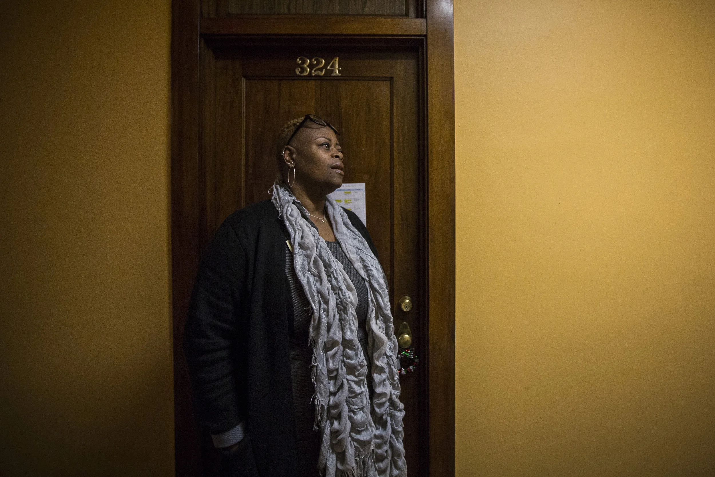  WaTasha stands in the hallway talking to a resident staying at the YWCA, Jan. 16, off of East Charles St. Muncie, IN. WaTasha listened to the young woman express her concerns for her upcoming court date with her abuser afraid of the possibility he m