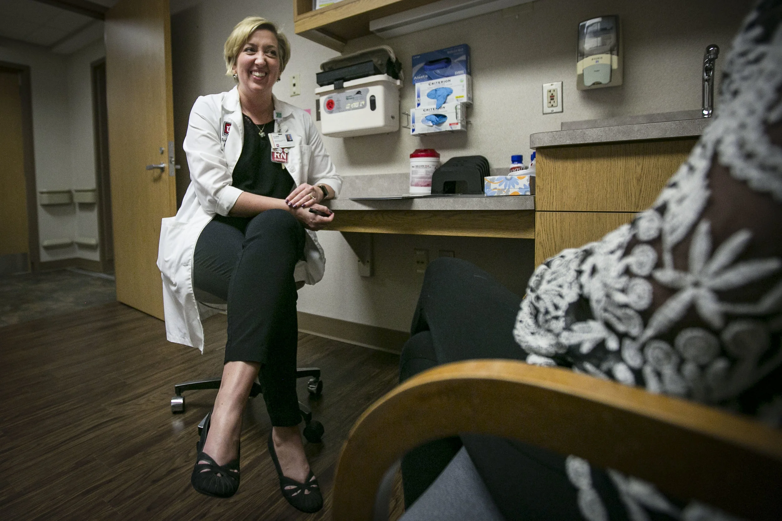  IU Ball Memorial Hospital Genomics Center bedside nurse Allison Spradlin talks to one of her cancer patients about her treatment, Feb. 27, Muncie, IN. For 13 years, Spradlin has helped coach cancer patients as they live with a possible terminal illn