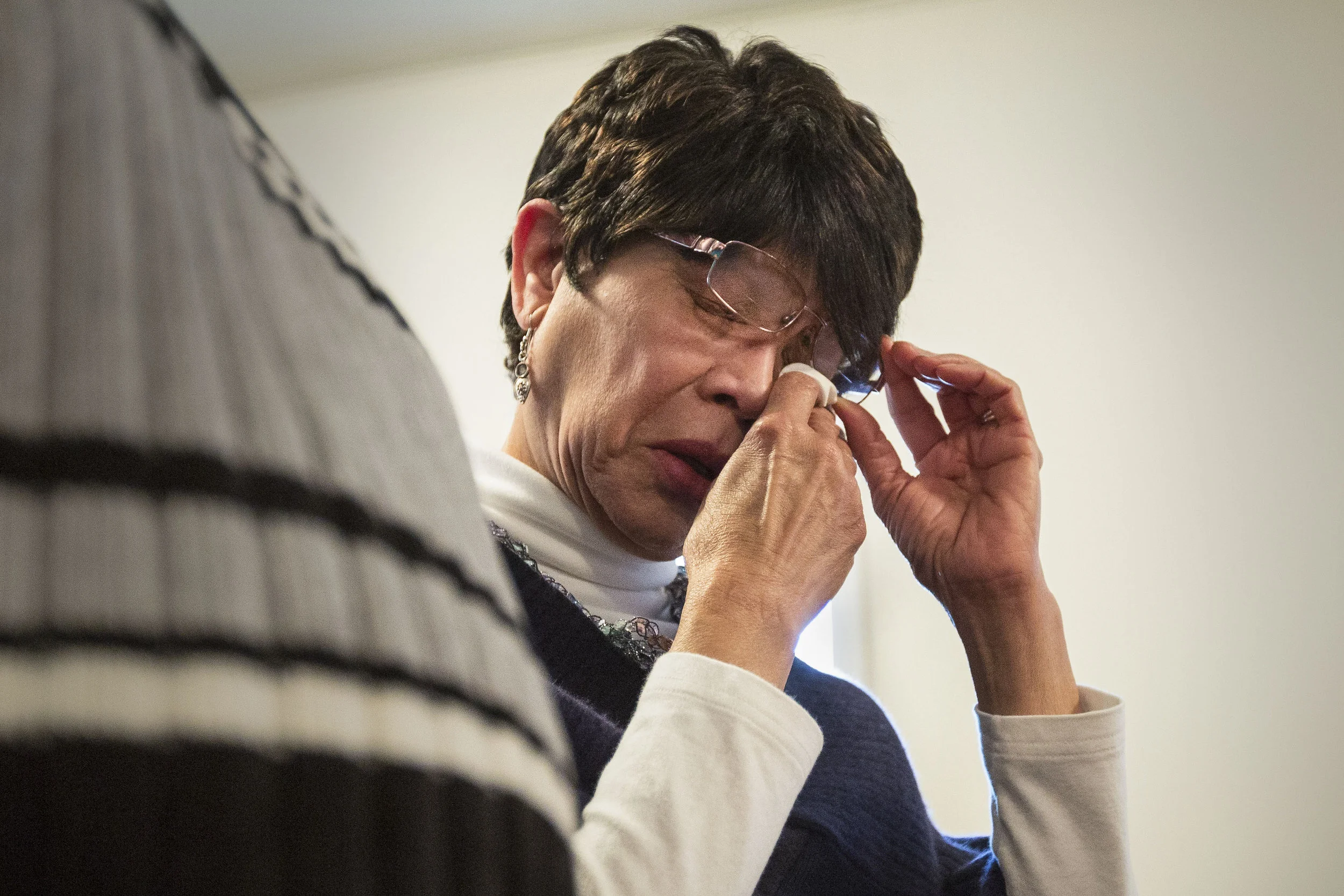  Standing next to her husband, Mary Dollison dries her tears while singing church hymns, Feb. 10, at Kirby Avenue Church of God, Muncie, IN. Mary and her family moved here from a small town in Louisiana and has attended the same church for the past 6