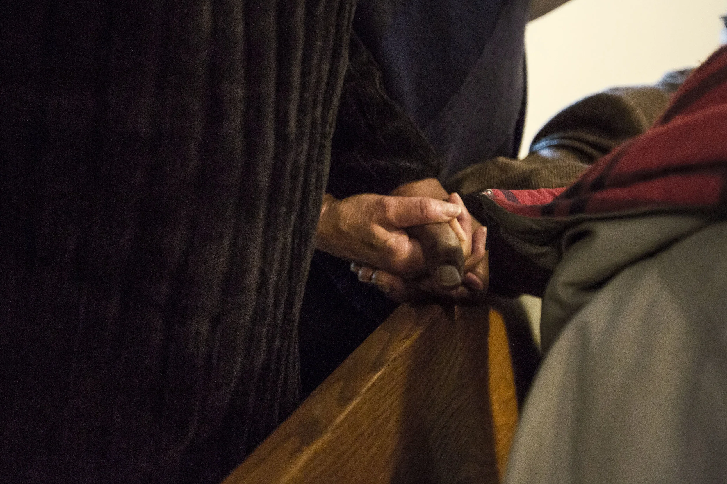  Mary Dollison grips the hand of her husband Cornelius as they sing church hymns, Feb. 10, at The Kirby Avenue Church of God, Muncie, IN. Mary Dollison desegregated Muncie elementary schools for teachers as the first black woman to be hired at Morris