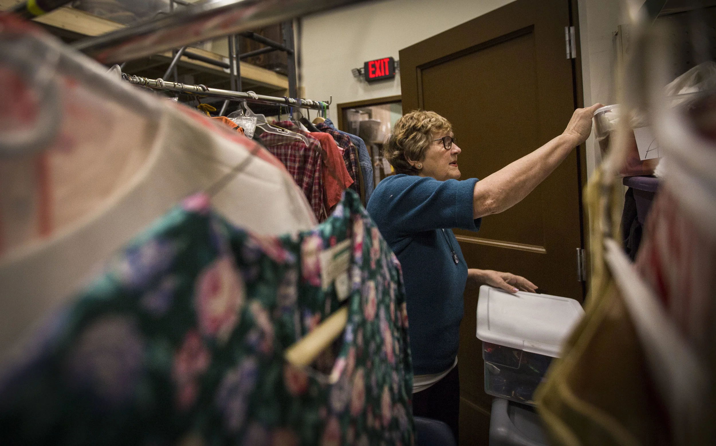  “I’m over here!” called Nancy Carlson from the rafters of the costume room at Muncie Civic Theatre, “This is cool, huh?” Nancy Carlson said, and looked around at the long isles of dresses, suits, and camel costumes. She stood on a platform 11 feet h