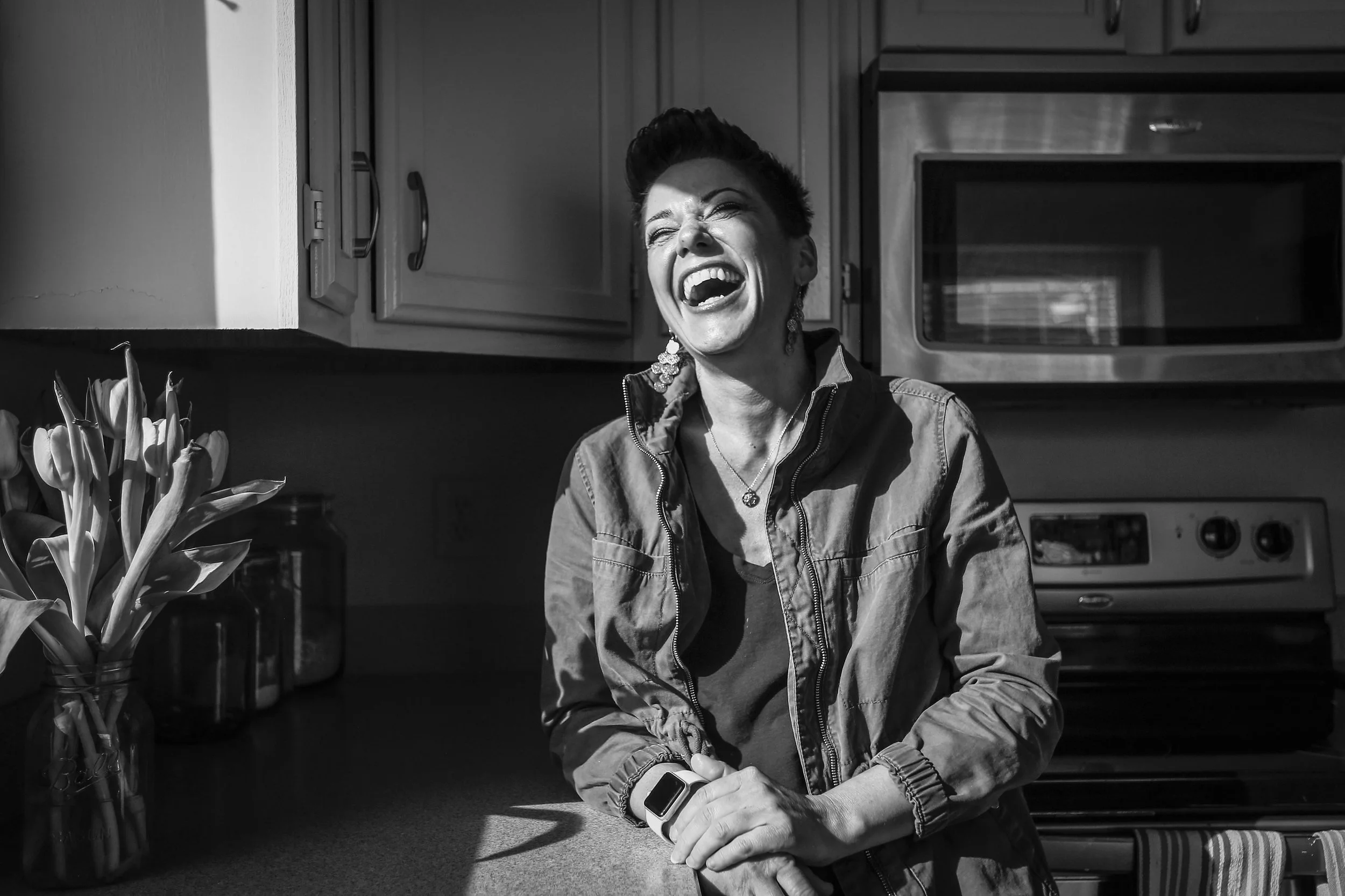  Melanie Howe stands laughing in her kitchen, March 19, in her Muncie, IN condo. Melanie is known for her energy or when she was the Bearcat mascot while attending Muncie Central High School. Recently, she has reached another audience besides the one