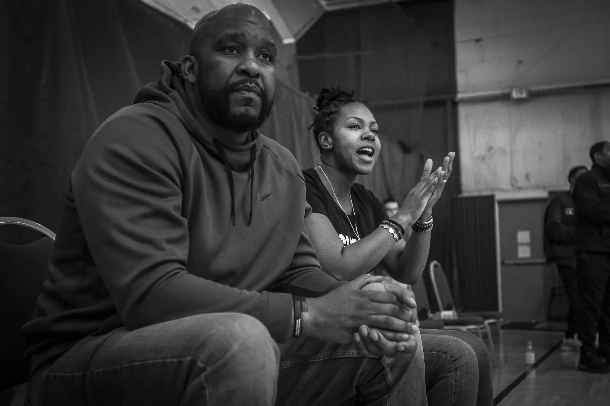  Dr. Mia Johnson (right) sits next to her husband while cheering for her son playing basketball at the Northwest YMCA, March 23, in Muncie, IN. Dr. Johnson is the Vice Chancellor of Academic Affairs at Ivy Tech and has been the at the center of diver