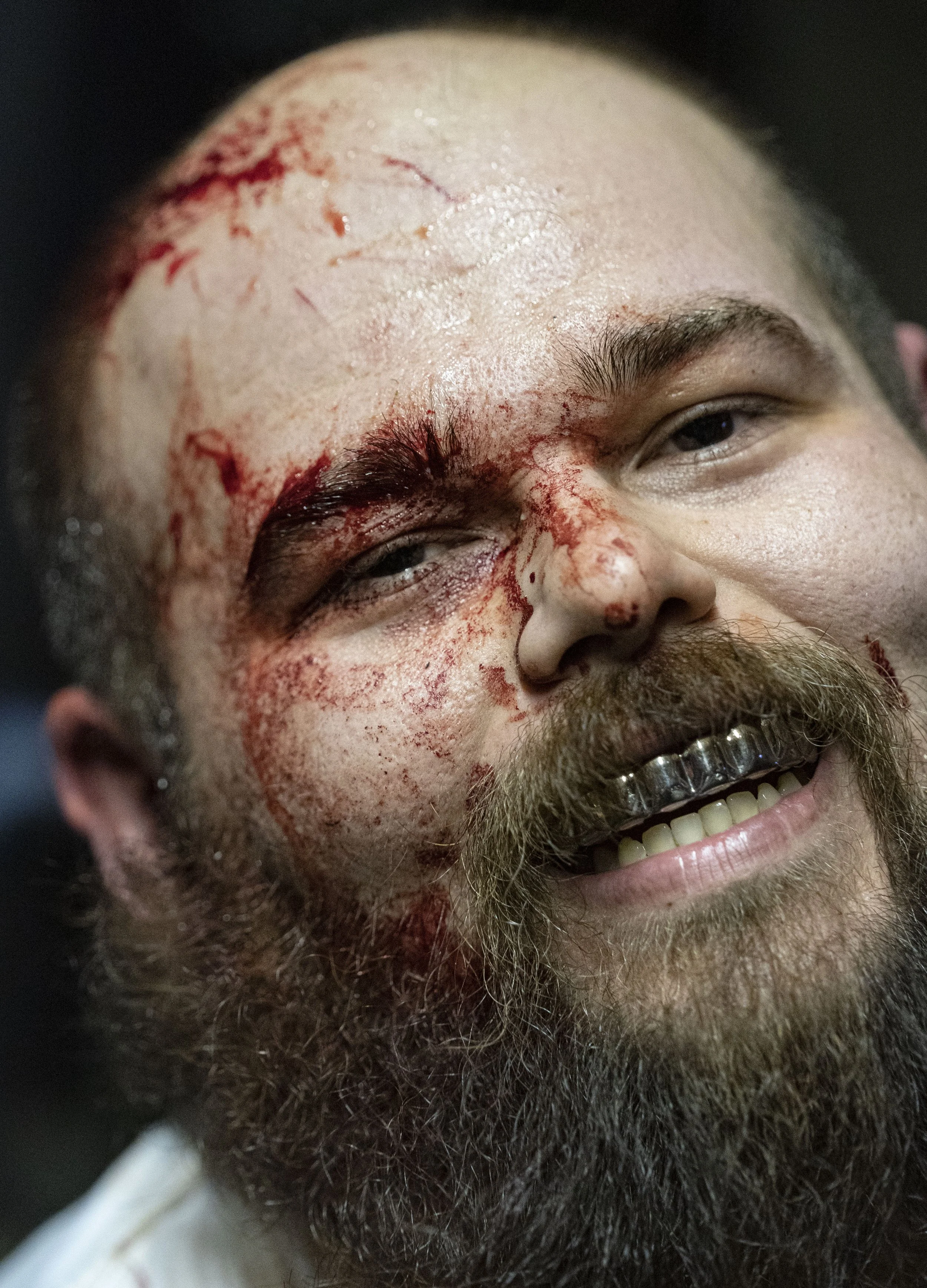  Shorty P smiles as blood cakes to his face after wrestling in a death match on Friday, Feb. 27, 2022 at the WCWO Wrestling School on Kentucky Avenue, in Indianapolis. 