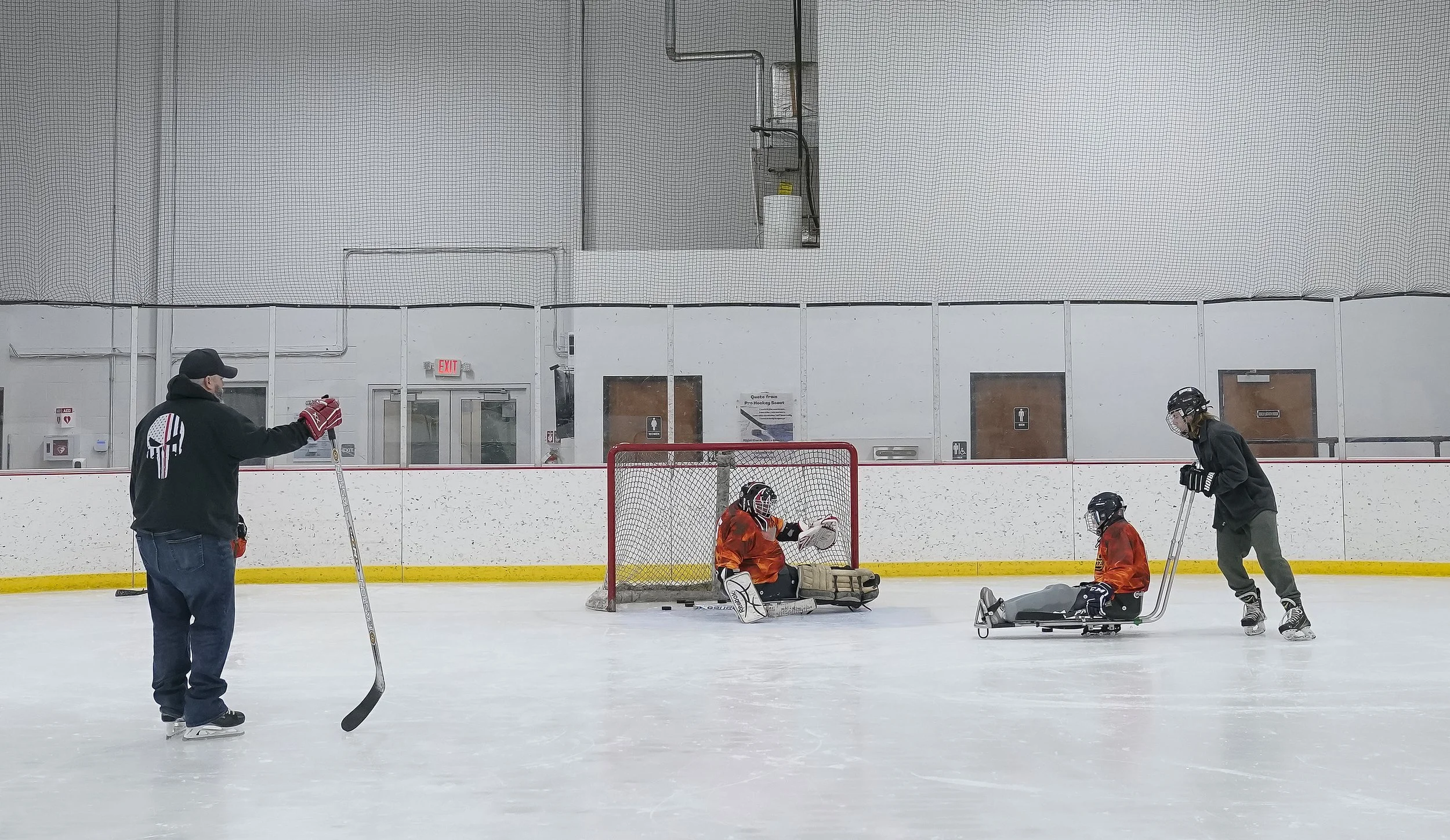  Marie Harman runs drills with her husband Indy Steel goalie Michael Harman on January 28, 2022, at the Ice Barn in Westfield. 