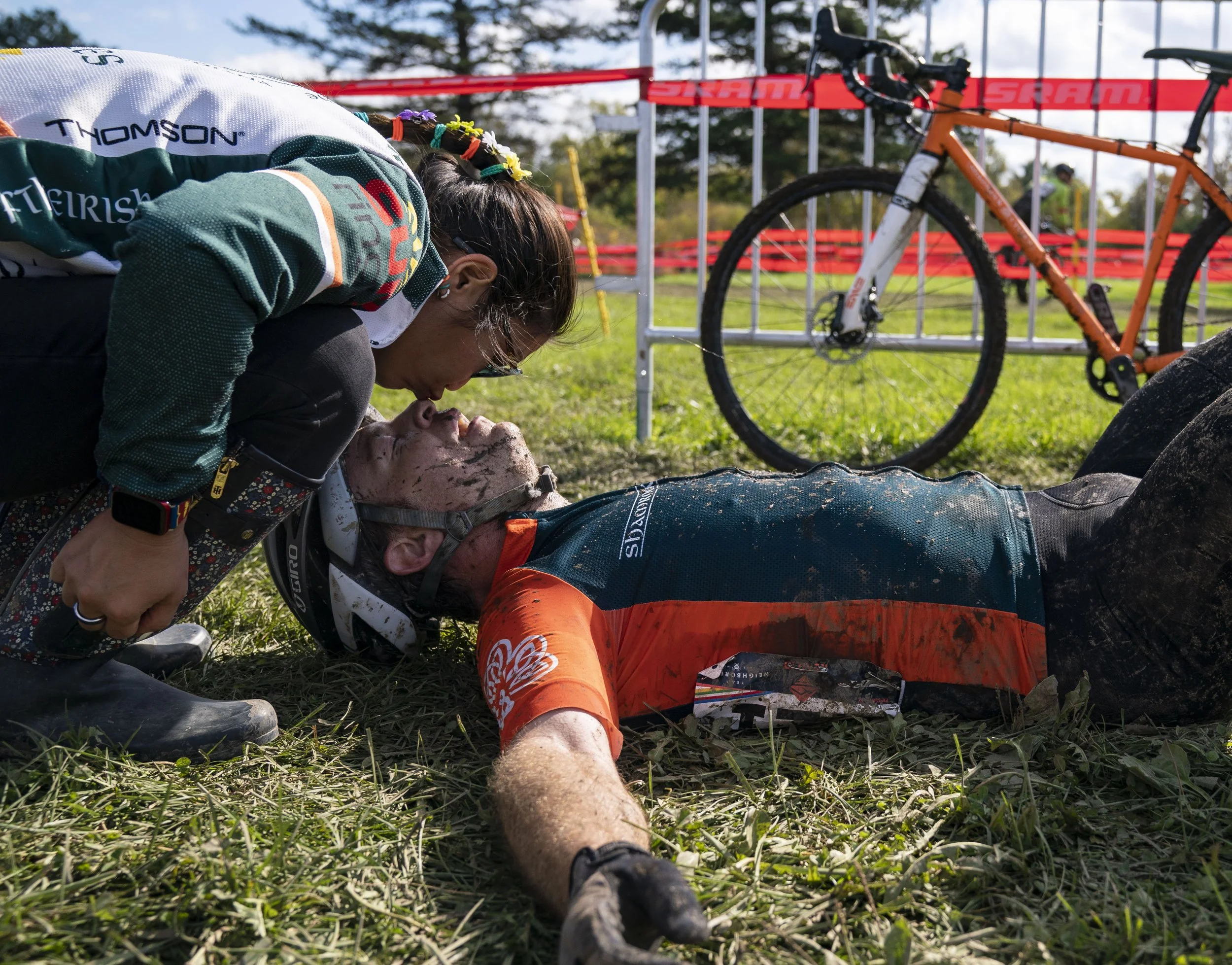  Will Sherman from Carmel lays on the ground as his wife kneels down to kiss his nose Sunday, Oct. 31, 2021 at the Indy Cycloplex on Cold Spring Road, in Indianapolis. Sherman competed in the Major Taylor Cross Cup race. "Actually, I think the hardes