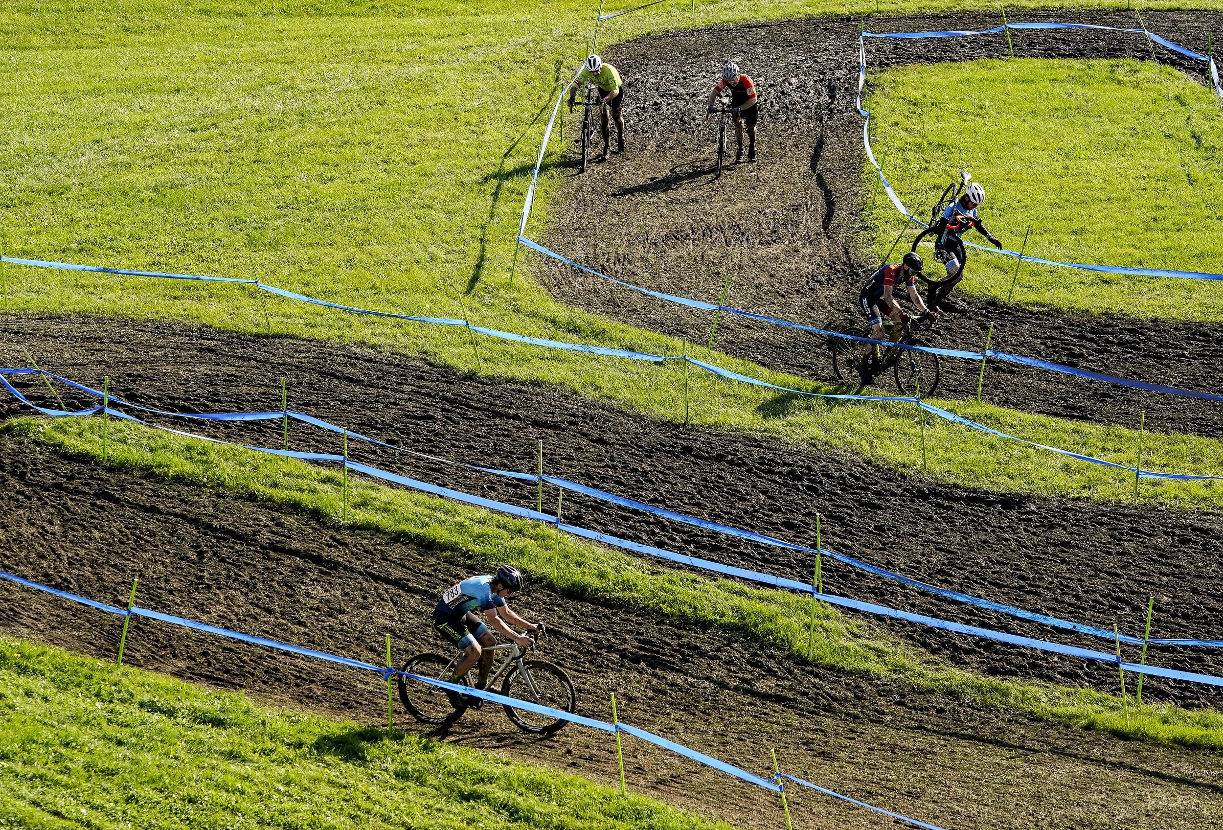  Riders race through the course during the Major Taylor Cross Cup race on Sunday, Oct. 31, 2021 at the Indy Cycloplex on Cold Spring Road, in Indianapolis. 