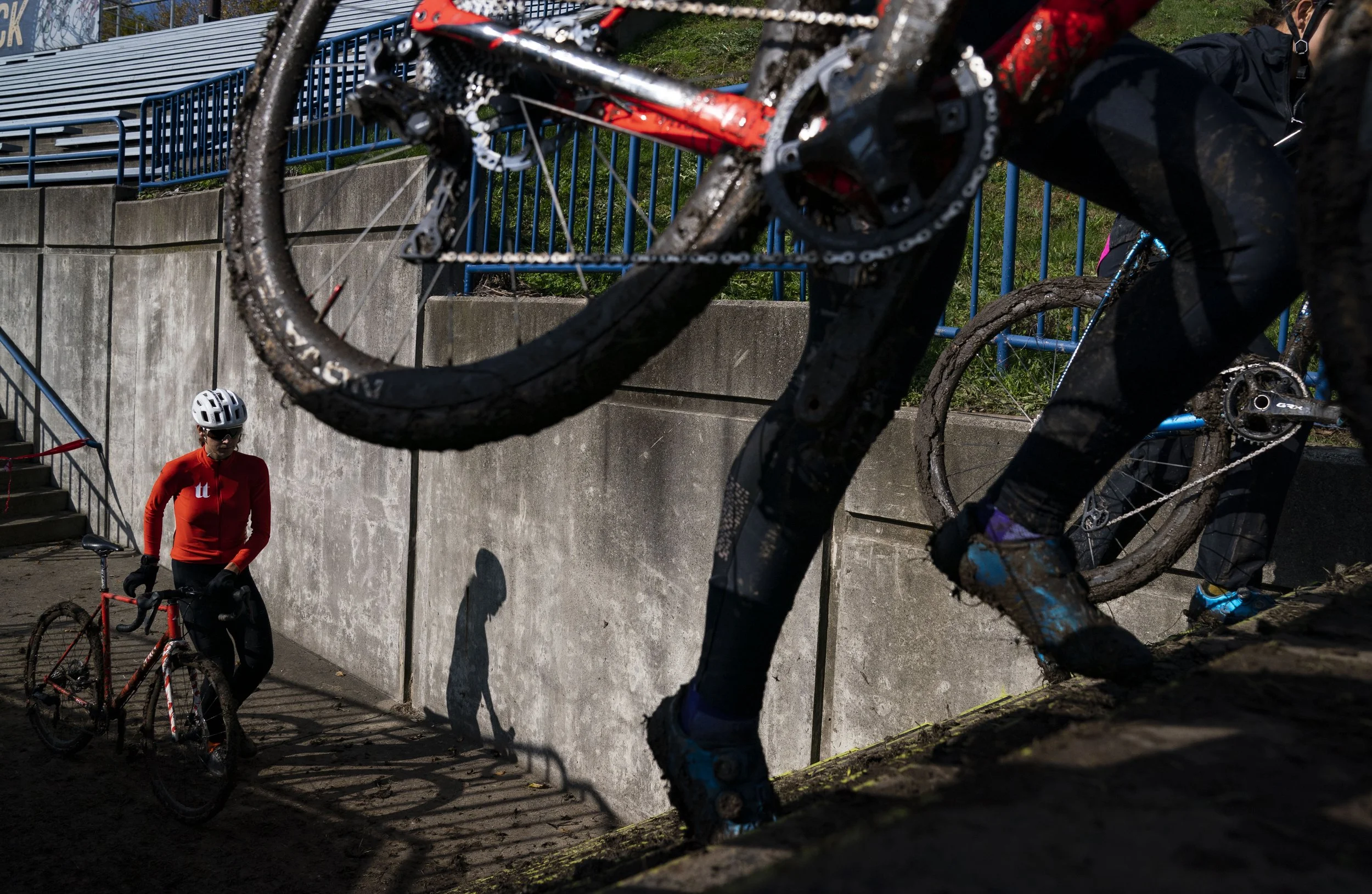  Cyclists carry their bikes upstairs during the Major Taylor Cross Cup race on Sunday, Oct. 31, 2021, at the Indy Cycloplex on Cold Spring Road, in Indianapolis. 