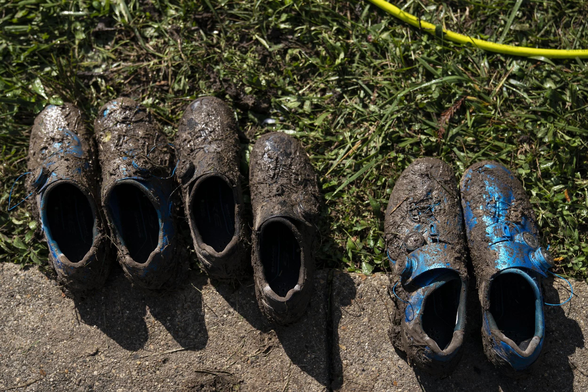  Muddy shoes of cyclists sit in the sun Sunday, Oct. 31, 2021 at the Indy Cycloplex on Cold Spring Road, in Indianapolis. 