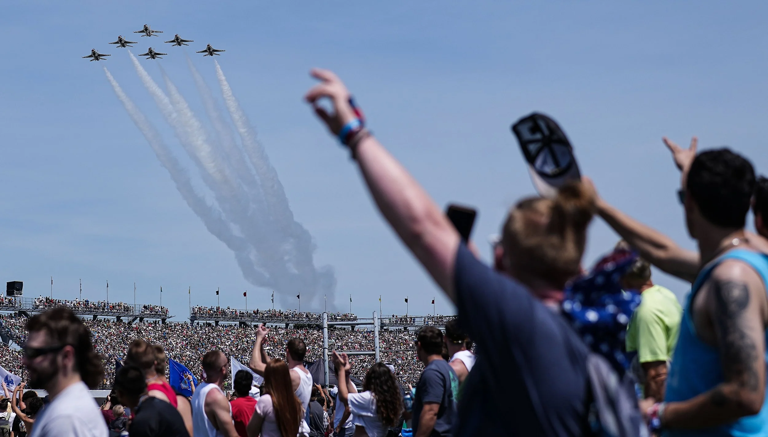  Racing fans cheer during the fly over on Saturday, May 28, 2022, ahead of the 106th running of the Indianapolis 500 at Indianapolis Motor Speedway. 
