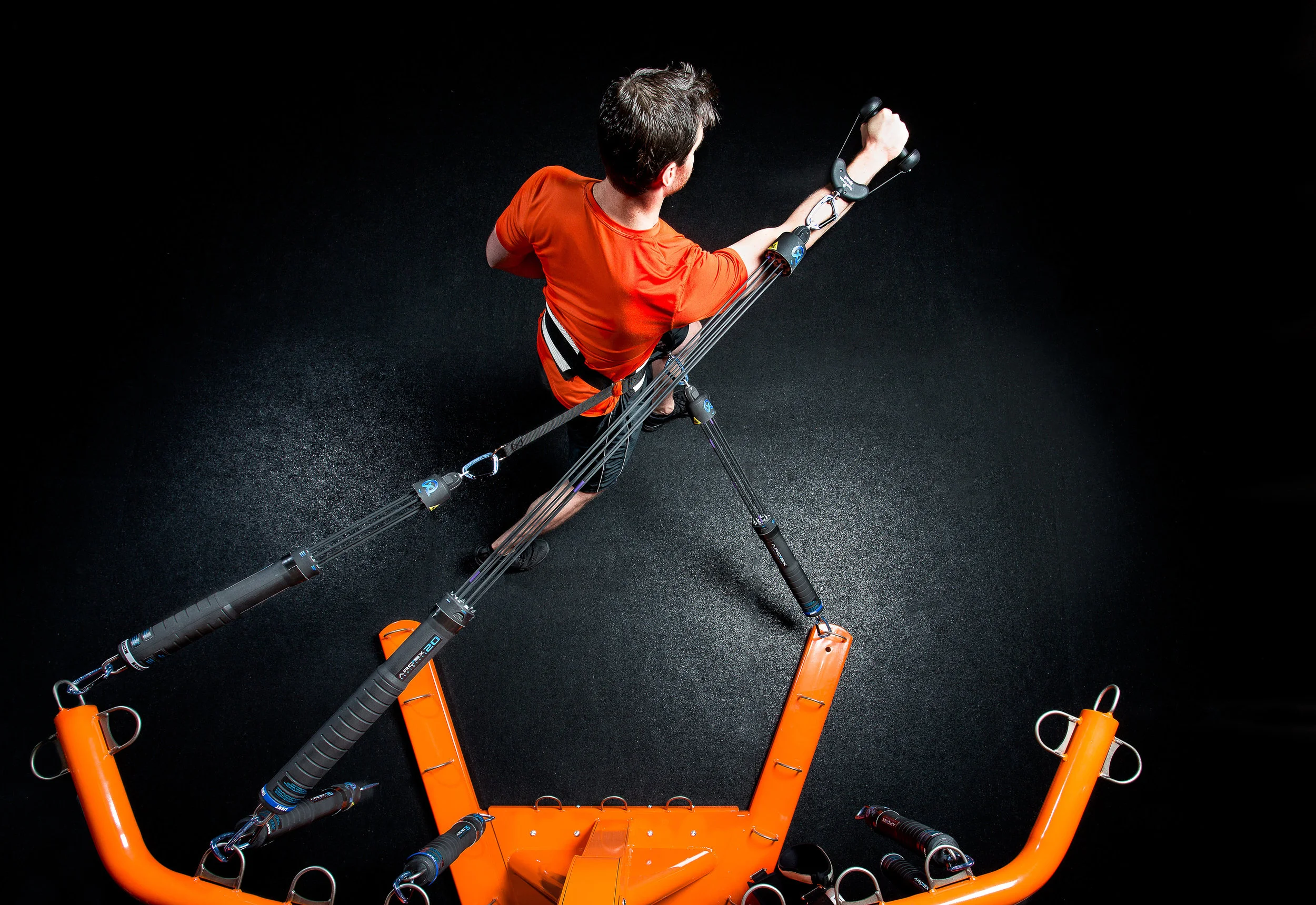Athlete performing a rotational pushing exercise on Arqex fitness