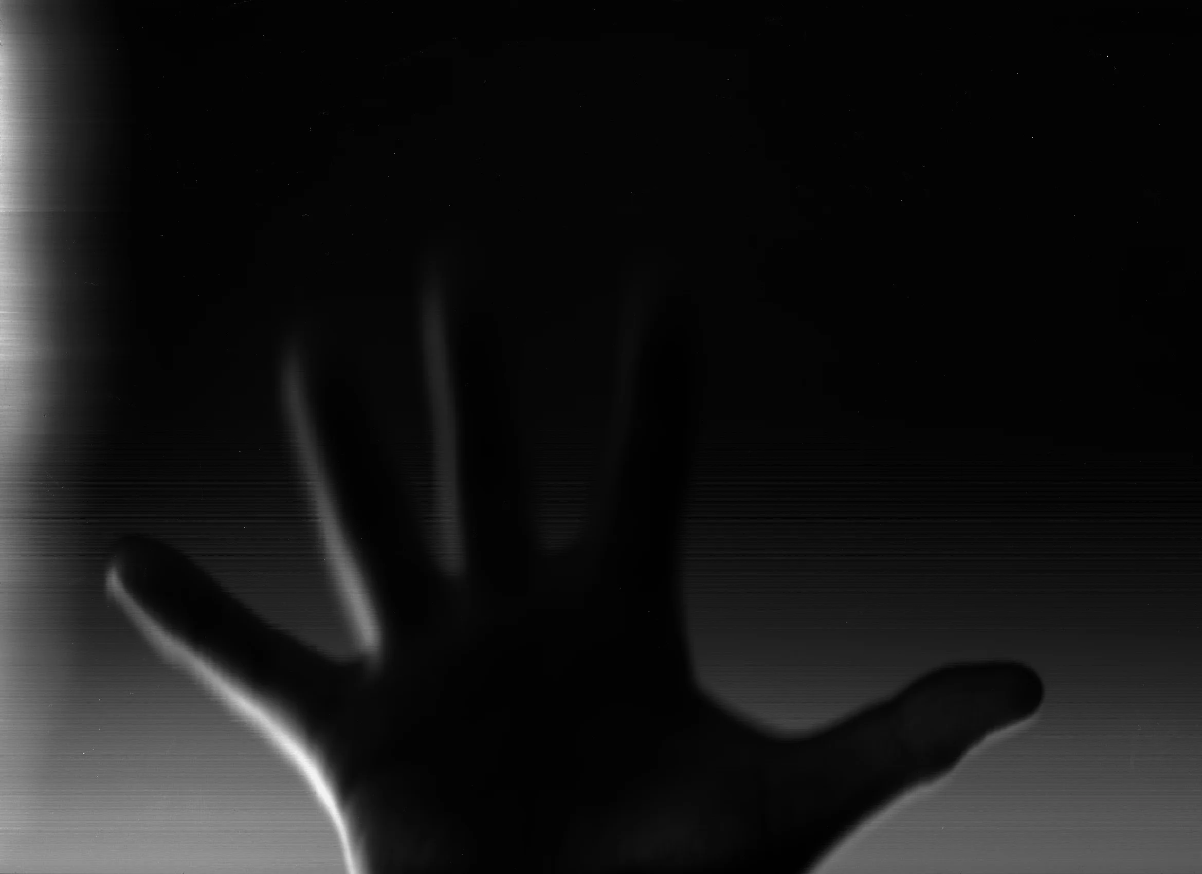 My hand is roughly 2 - 5 inches away from the scanner glass here.