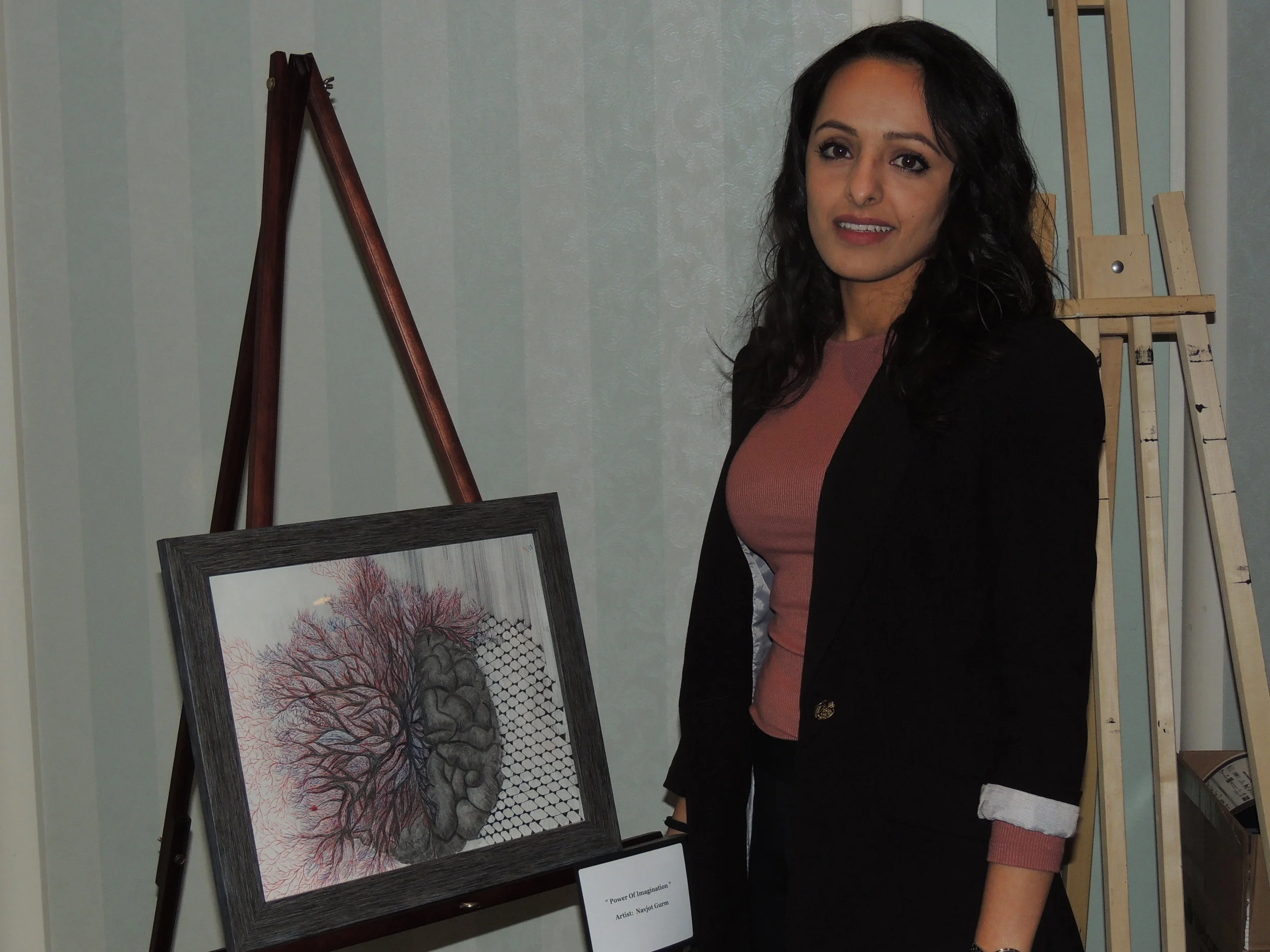 The Artis 3 Featurette artist and ABI & mental health advocate Navjot Gurm & some of her artwork. Photo by Mira Louis.