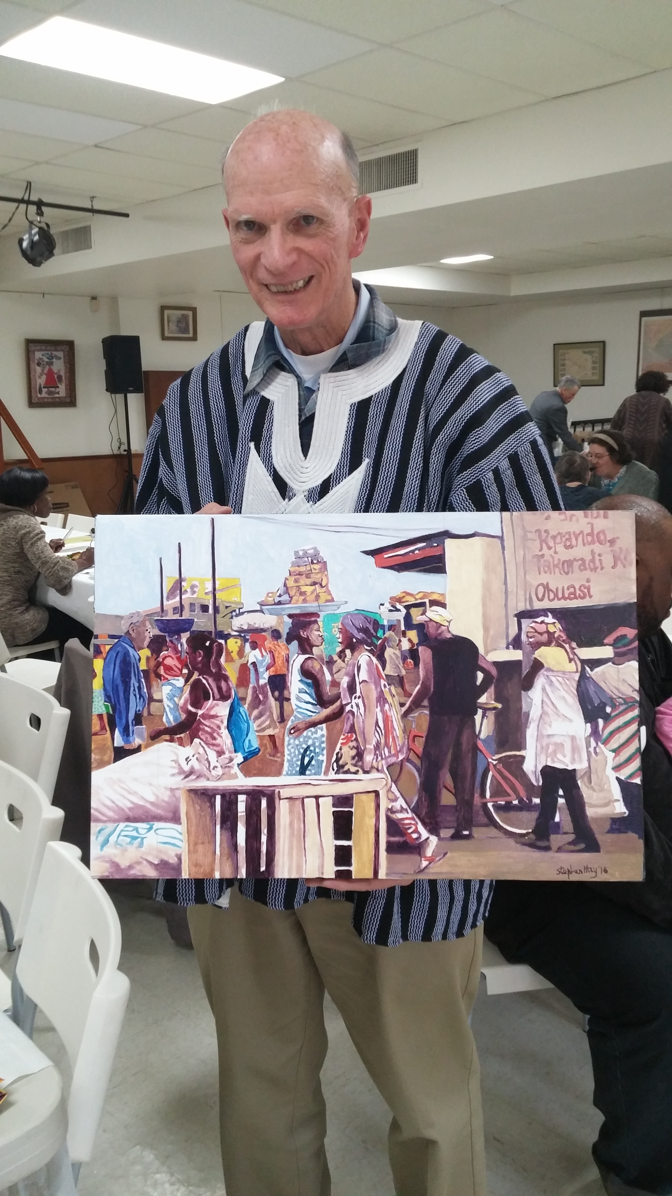 Dan O'Laughlin holding painting.jpg