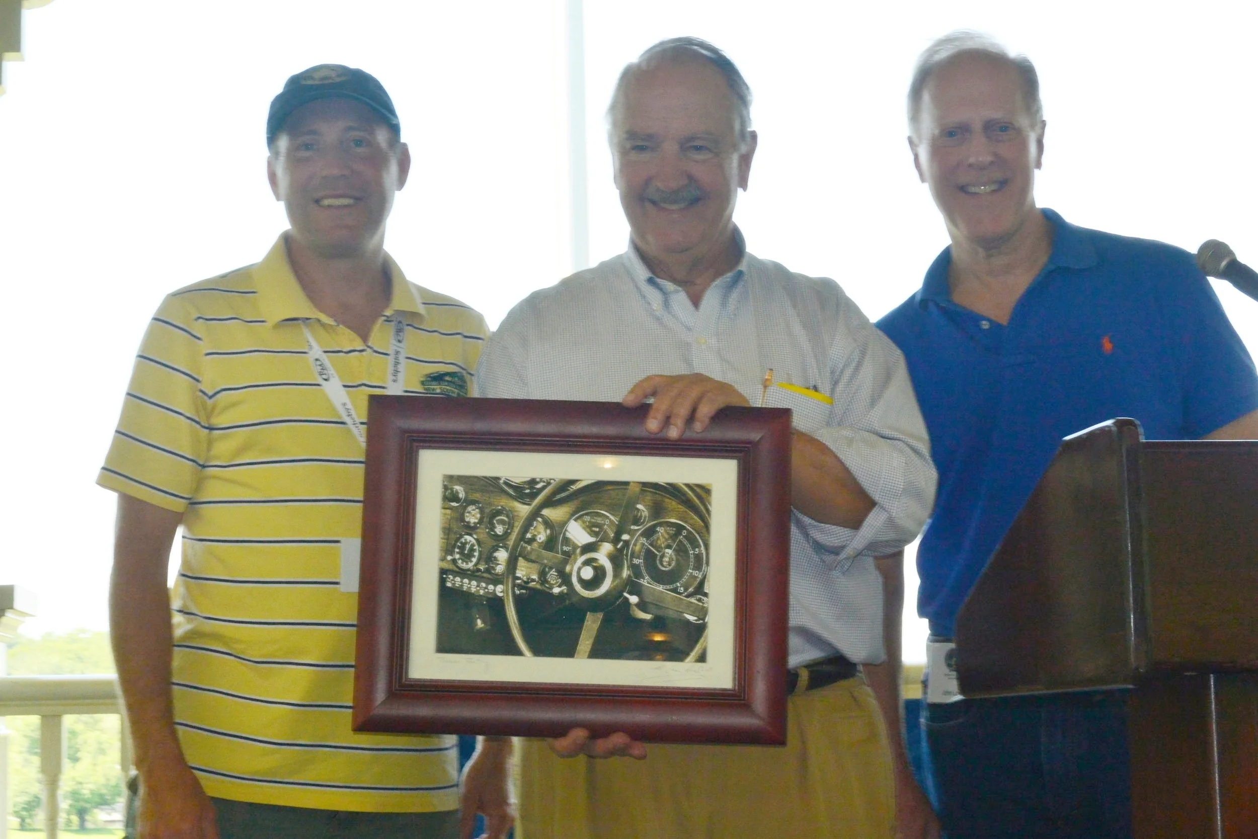 Steve Brauer accepting a gift of gratitude from the UMR and Spirit Regions. Alongside are Webster Peterson (l), organizer of the Nordic CARavan, and John Lowell (r), Spirit Region Director.