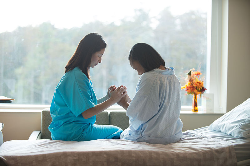 Praying_with_Patient.png