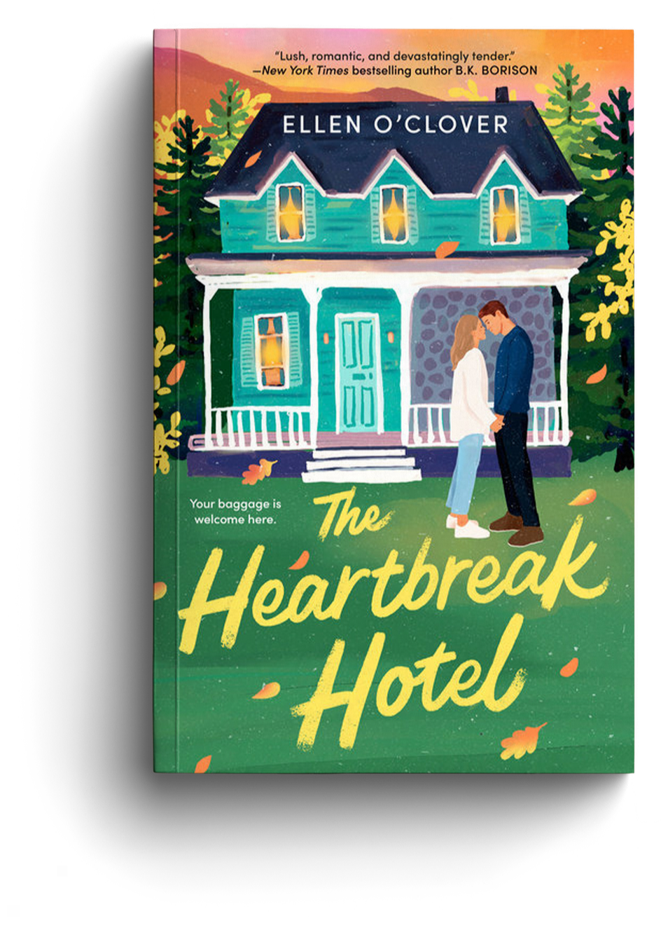 Book cover titled "The Heartbreak Hotel" by Ellen O'Clover featuring an illustration of a teal house with a porch, surrounded by trees, with a couple standing close and holding hands in front of it during an autumn scene.