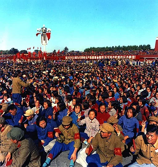 Image: Red Guards Waiting in Tiananmen Square , 1966. Public Domain via Wikimedia Commons . Thumbnail Image: Spectators in front of a large sign on Nixon's motorcade route in China , 1972. Public Domain via Wikimedia Commons .
